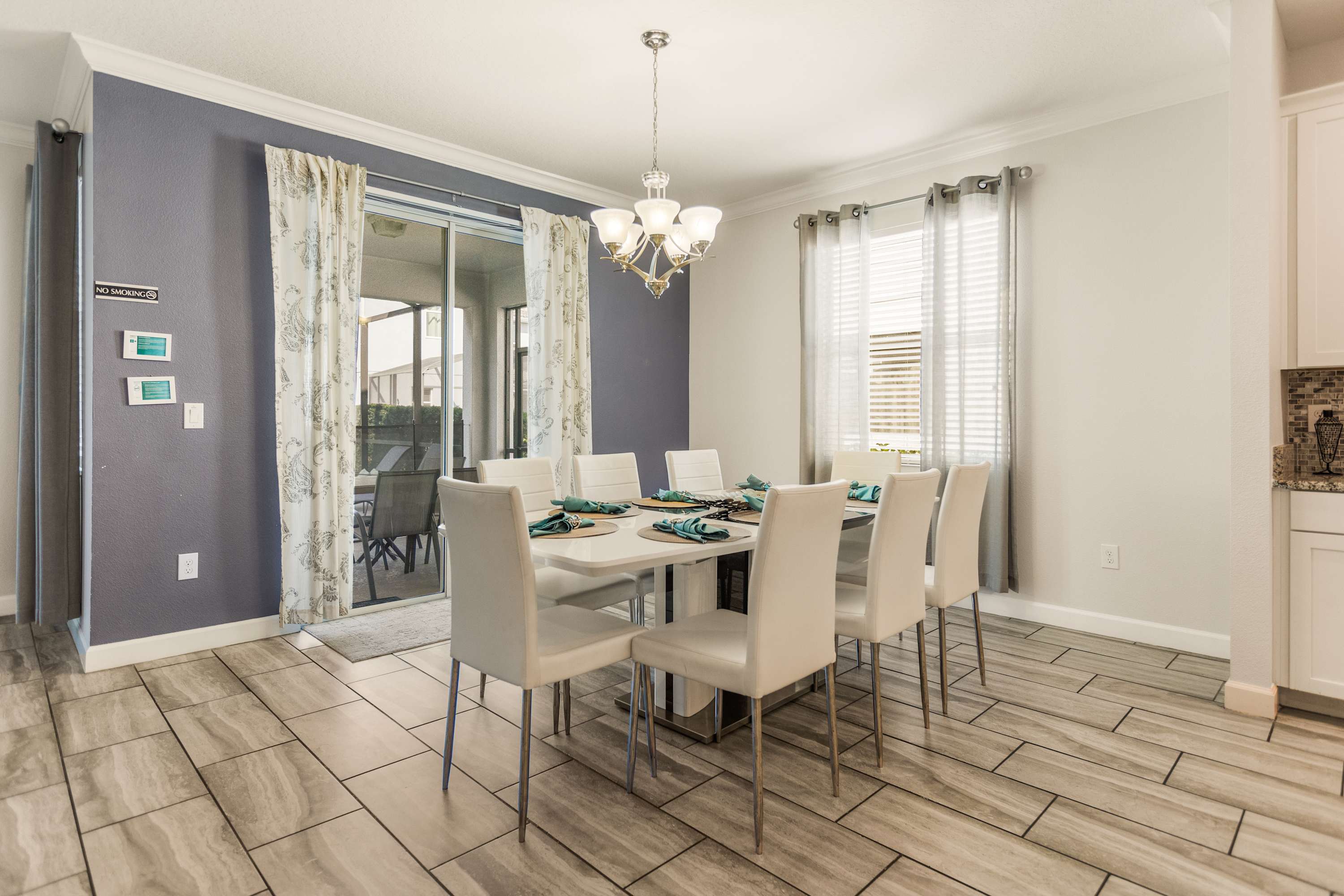 Elegant dining room with seating for eight, perfect for family gatherings and entertaining guests.