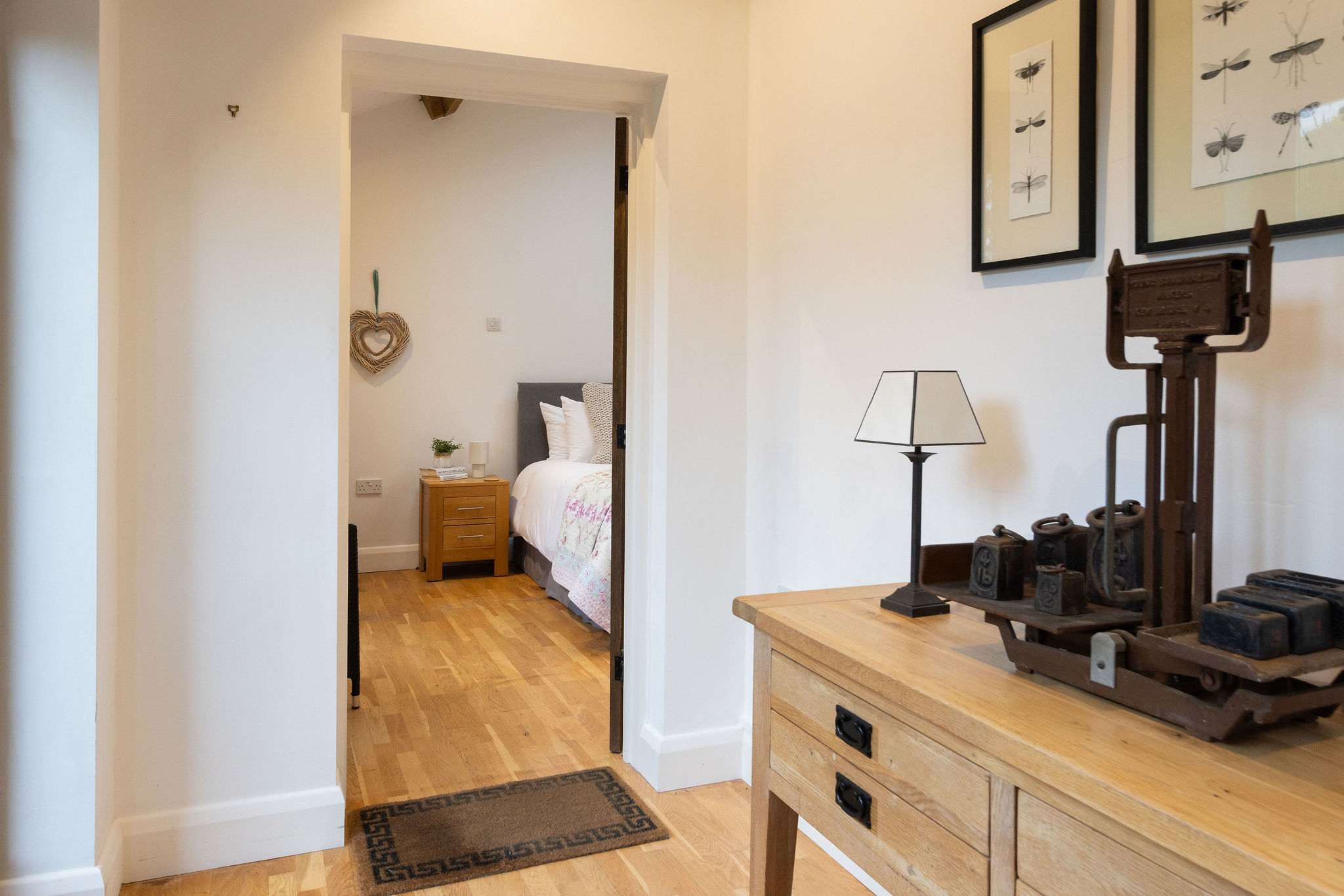 The bedroom leads off a shared entrance hall with another ensuite bedroom.