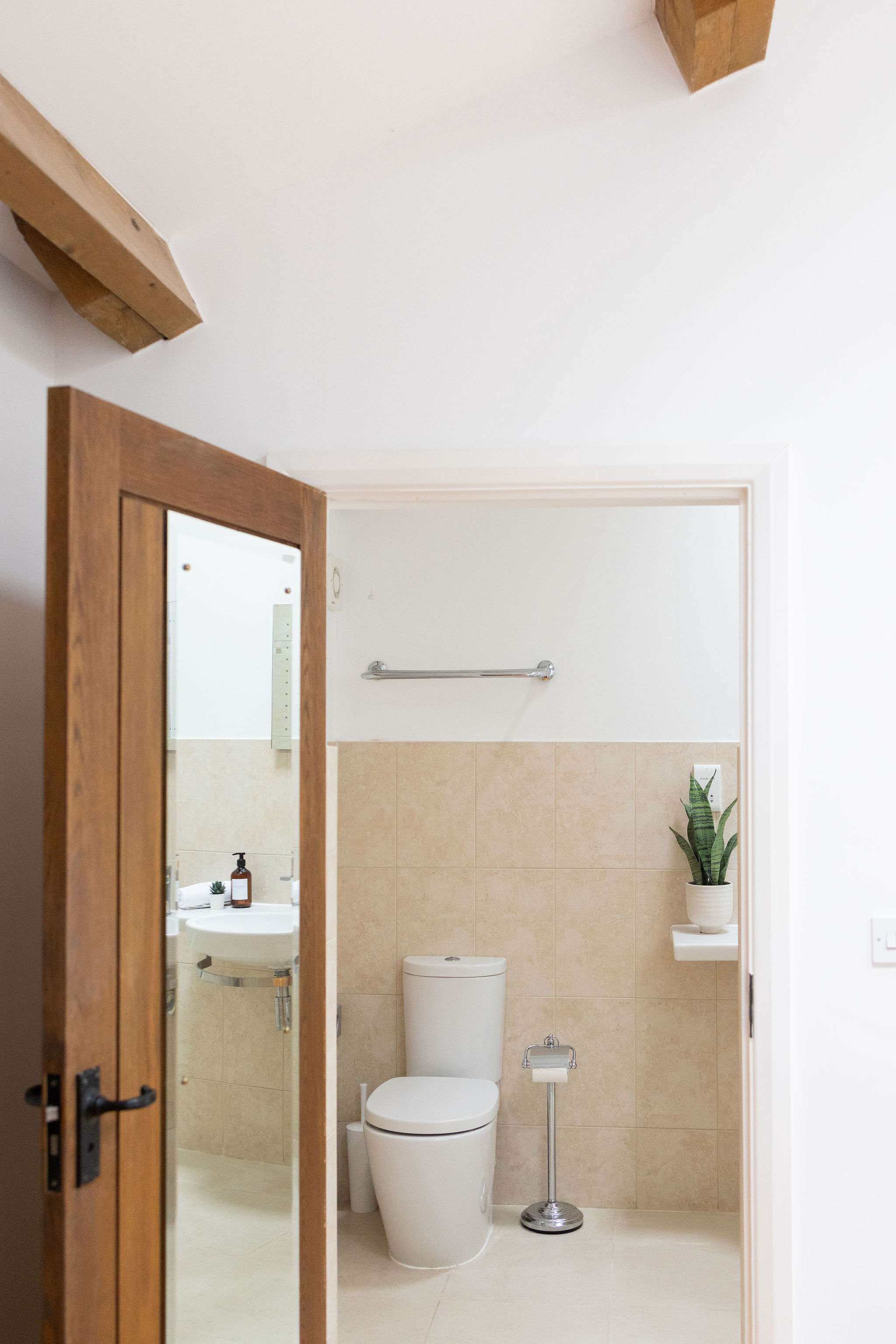 A mirrored door connects the room to the ensuite.