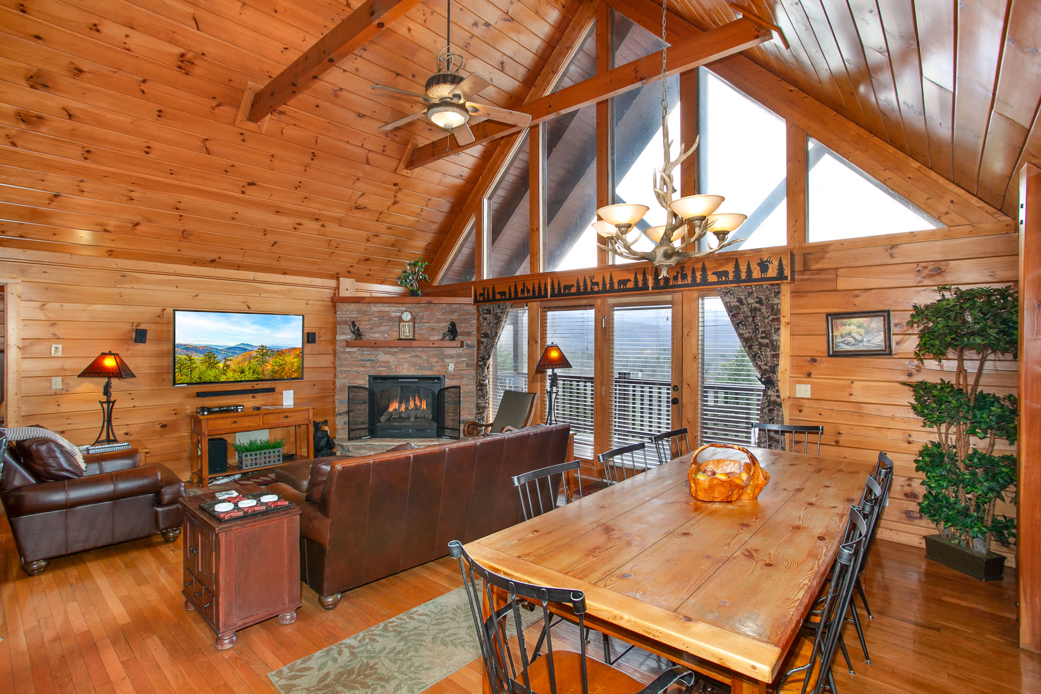 Gather for meals and movies in this bright, open-concept living and dining area.