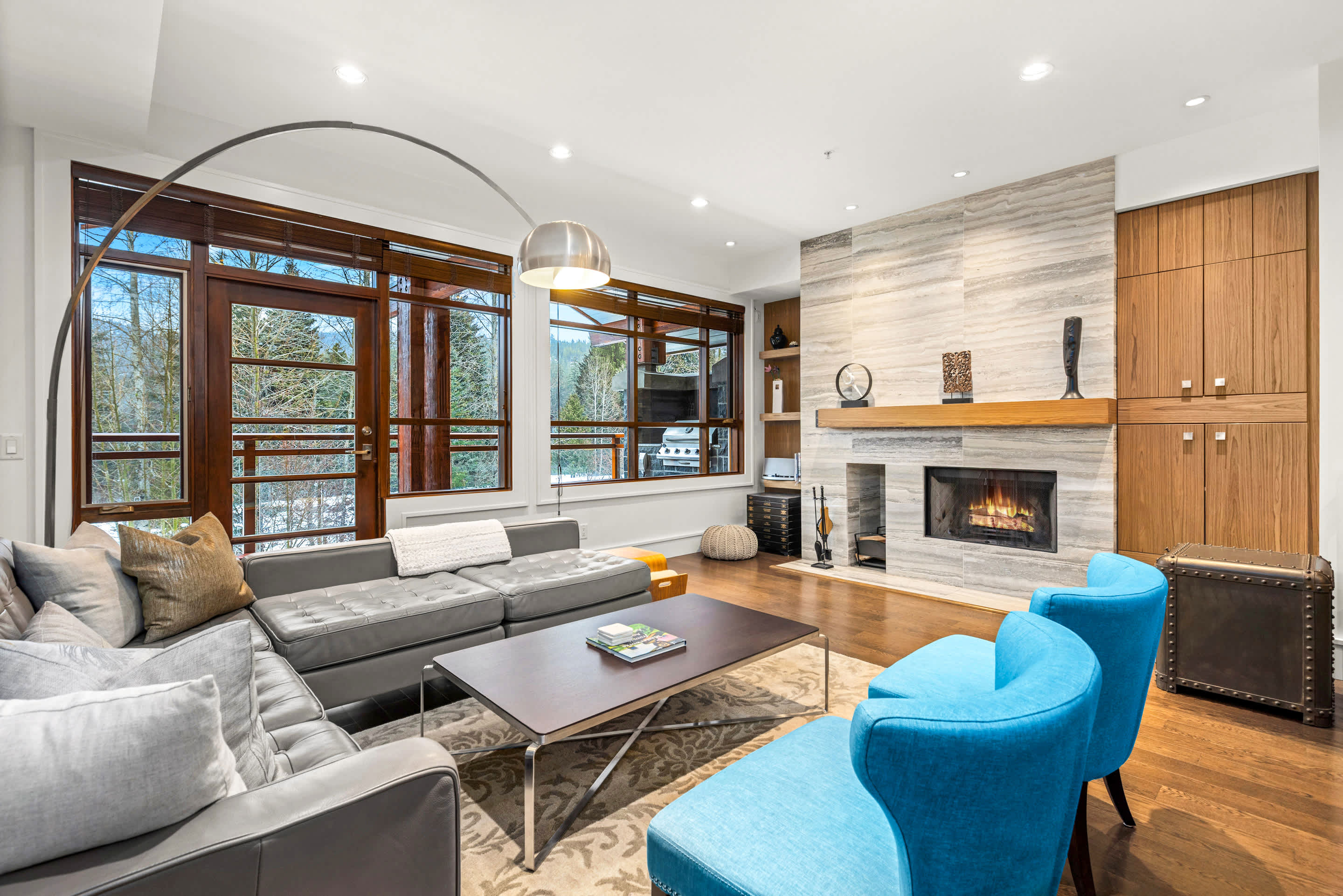 - Spacious living room with stone fireplace and big picture windows