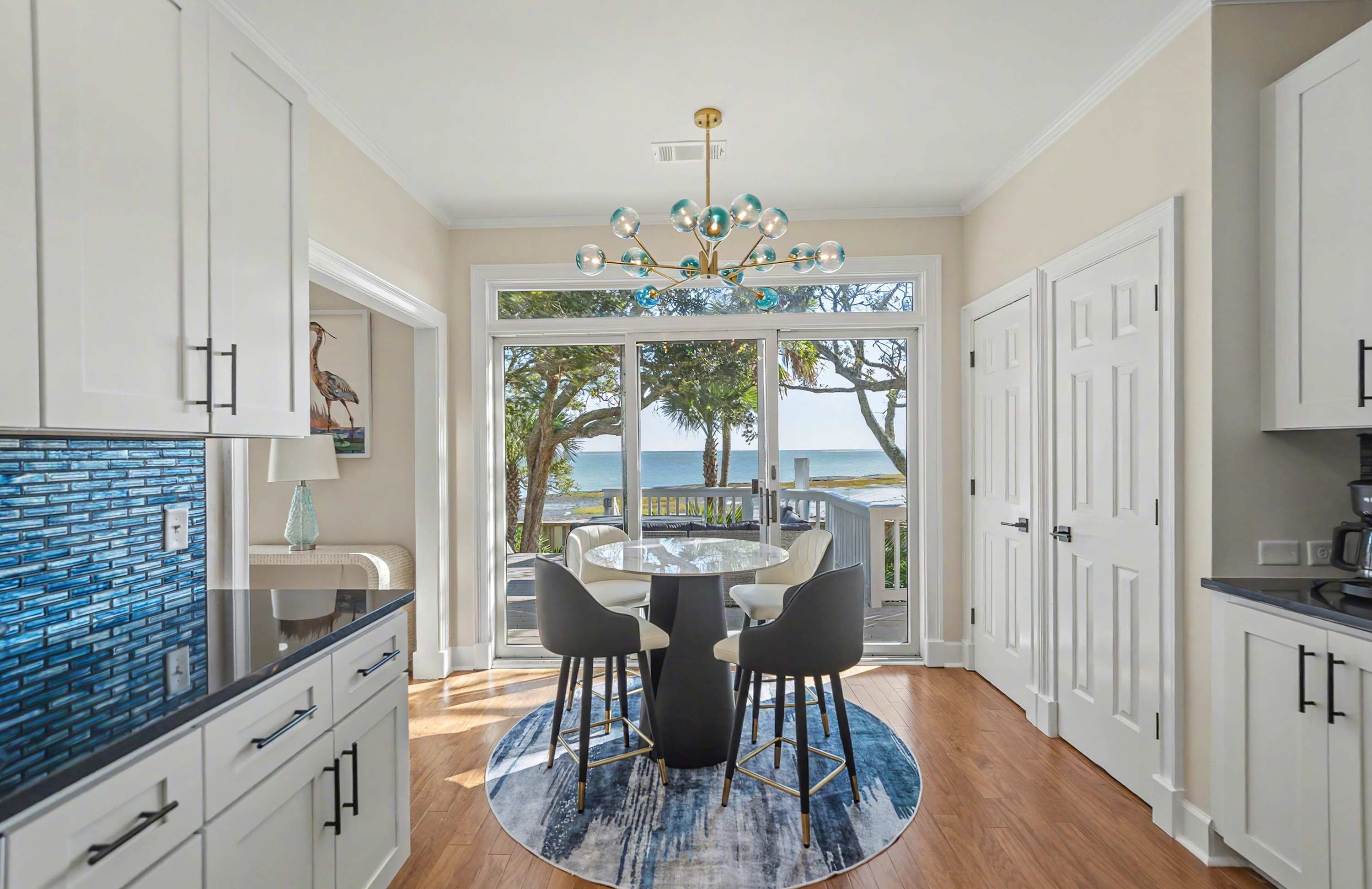 Kitchen with Additional Table with Access out to Back Deck 