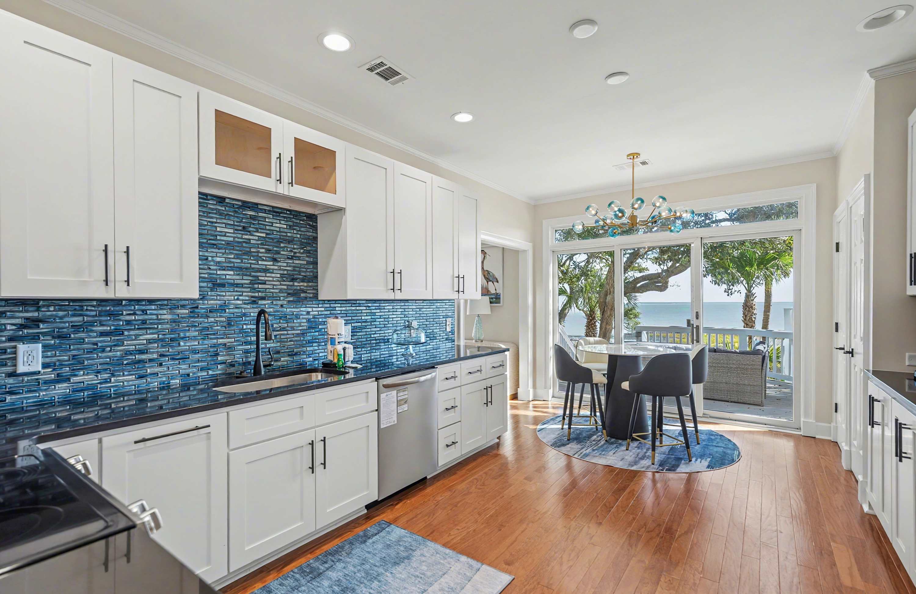 Kitchen with Additional Table with Access out to Back Deck 