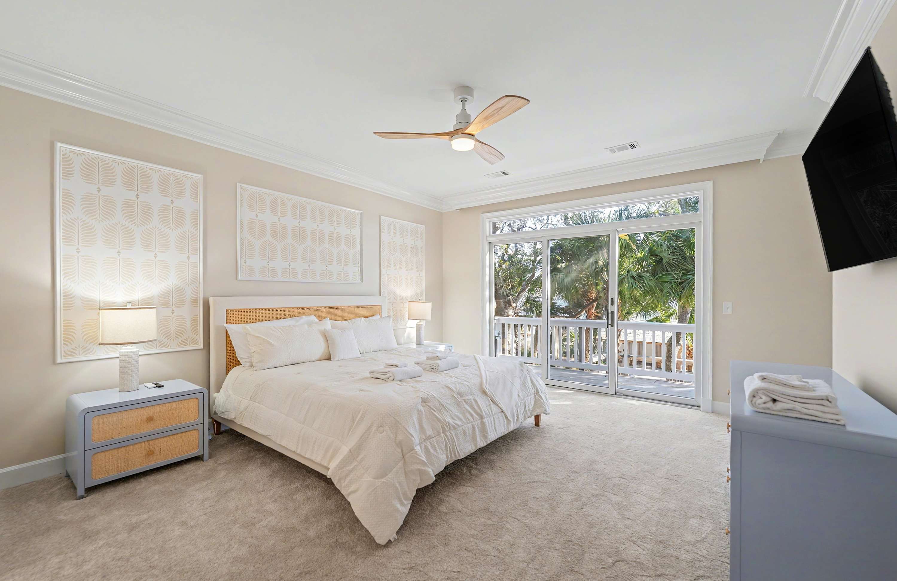Primary Bedroom with King Bed and Sliding Glass Door to Back Deck 