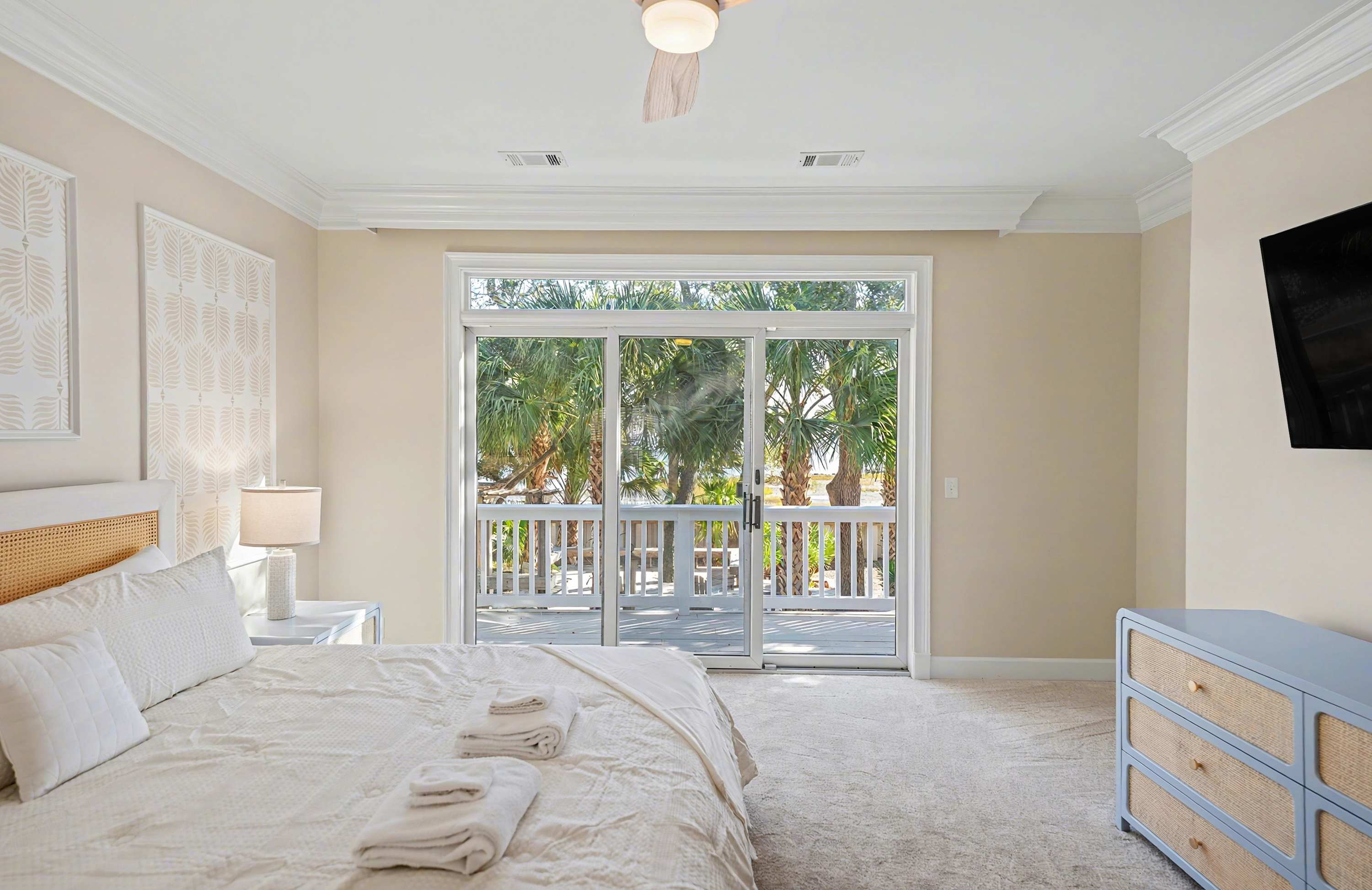 Primary Bedroom with King Bed and Sliding Glass Door to Back Deck 