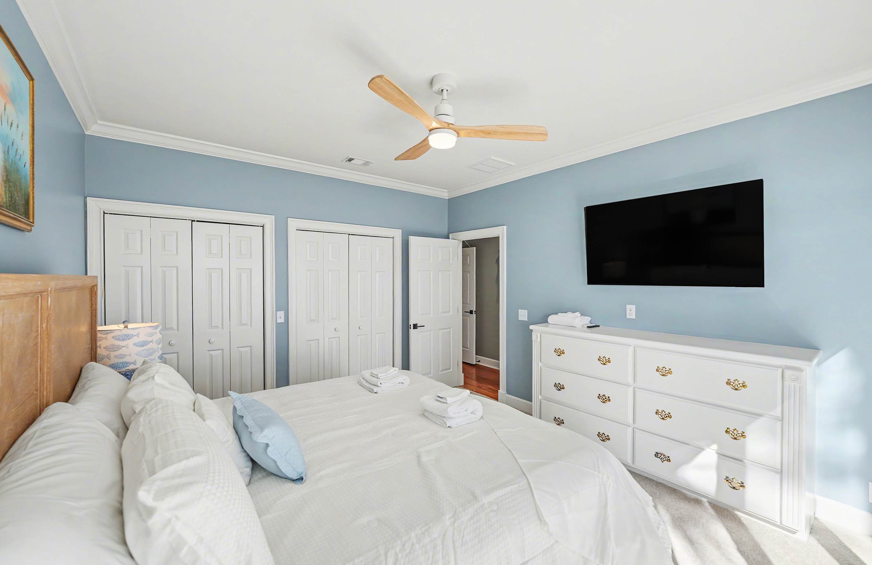 Guest Bedroom Featuring a King Bed and Access to Back Deck