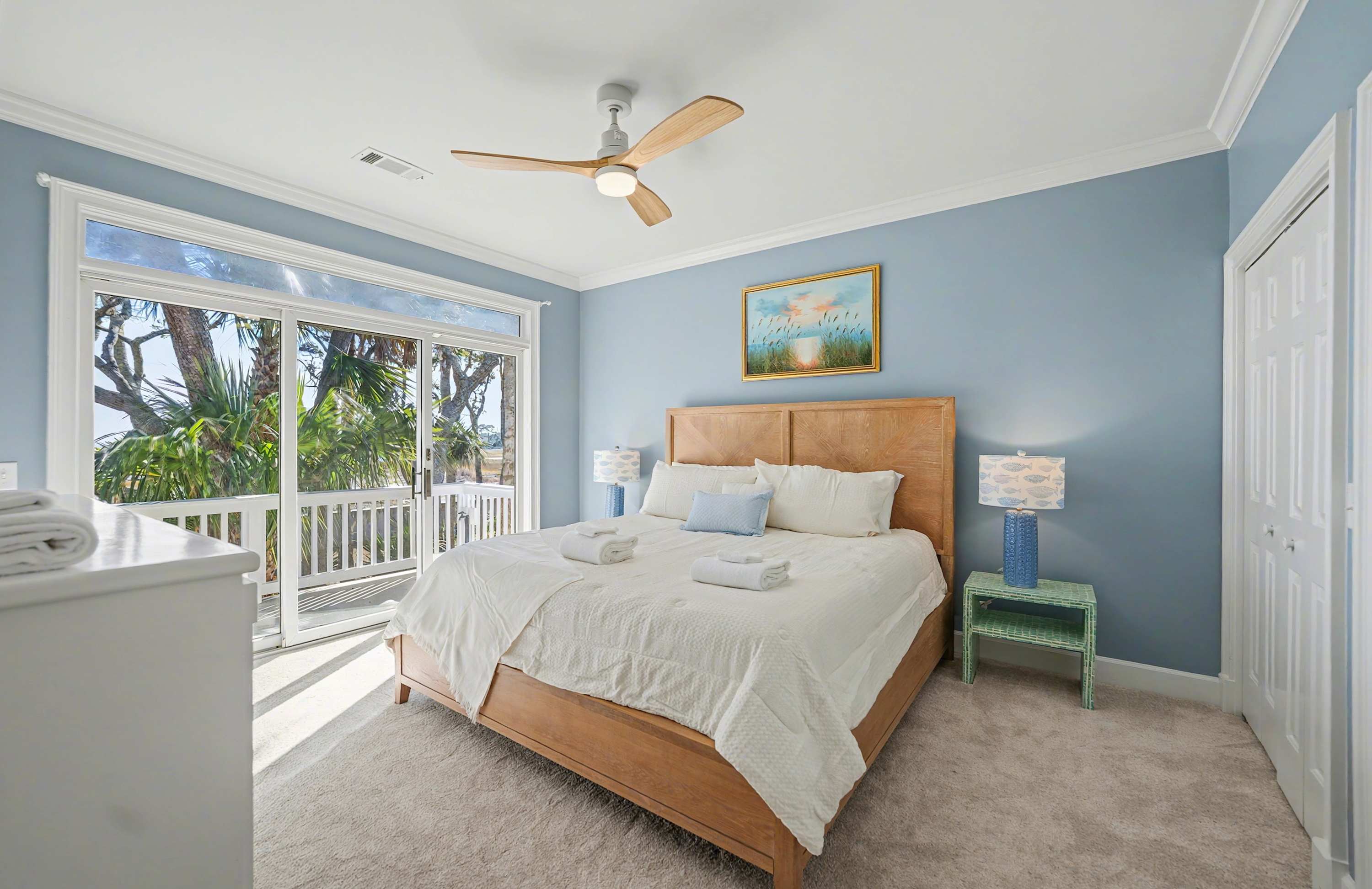 Guest Bedroom Featuring a King Bed and Access to Back Deck