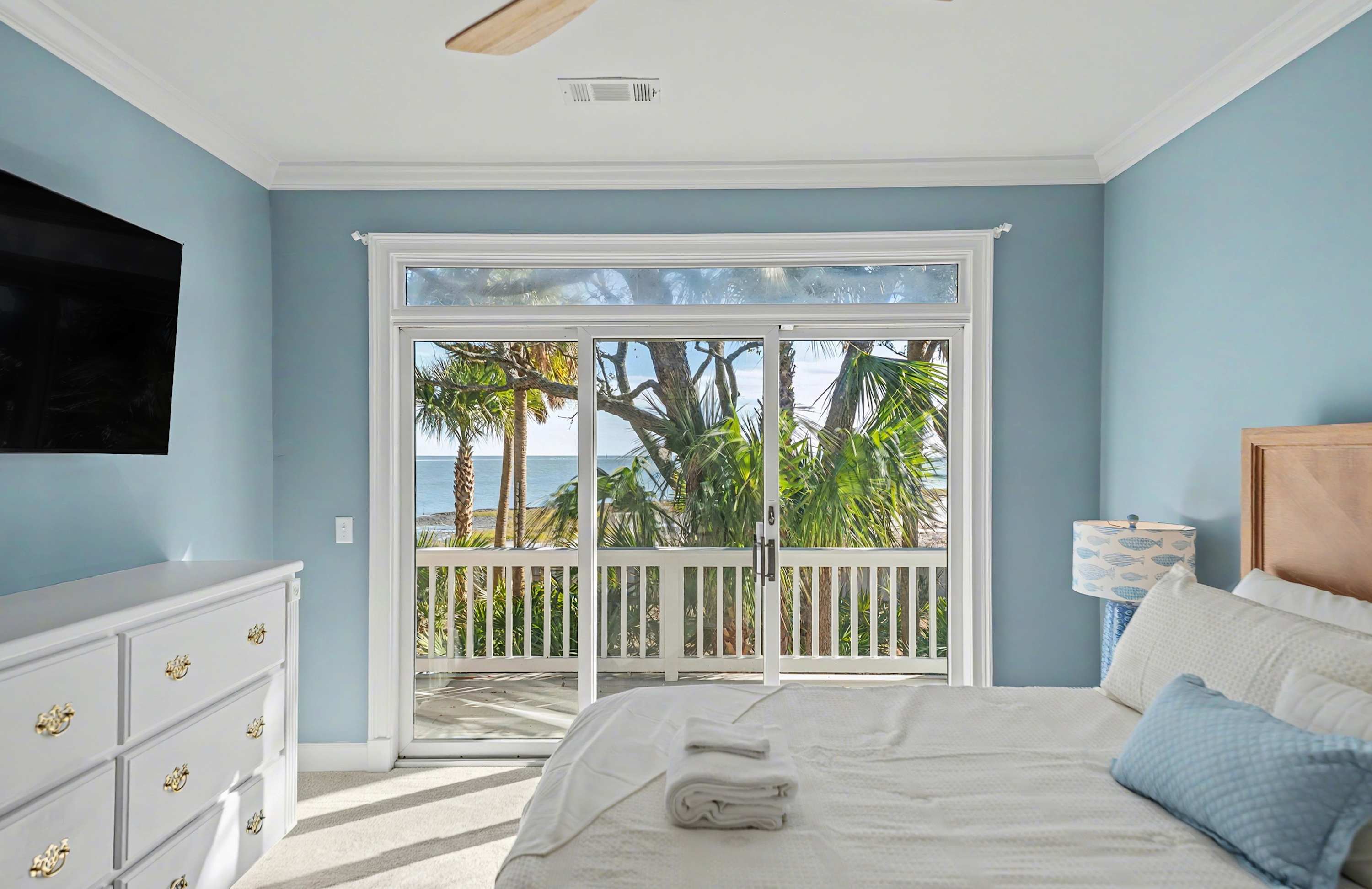Guest Bedroom Featuring a King Bed and Access to Back Deck