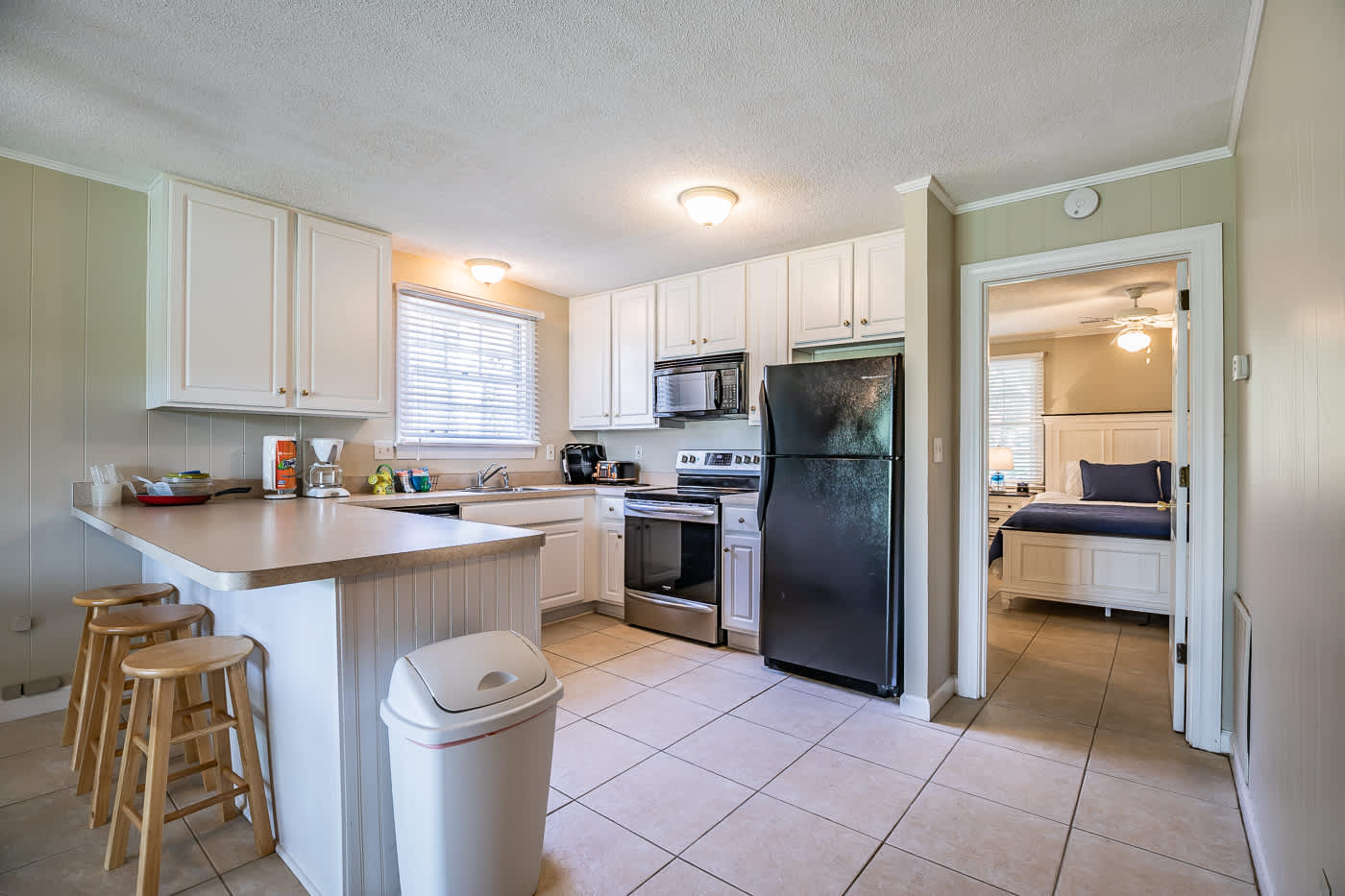 Kitchen in Ground Floor Apartment and entry to Primary Bedroom 