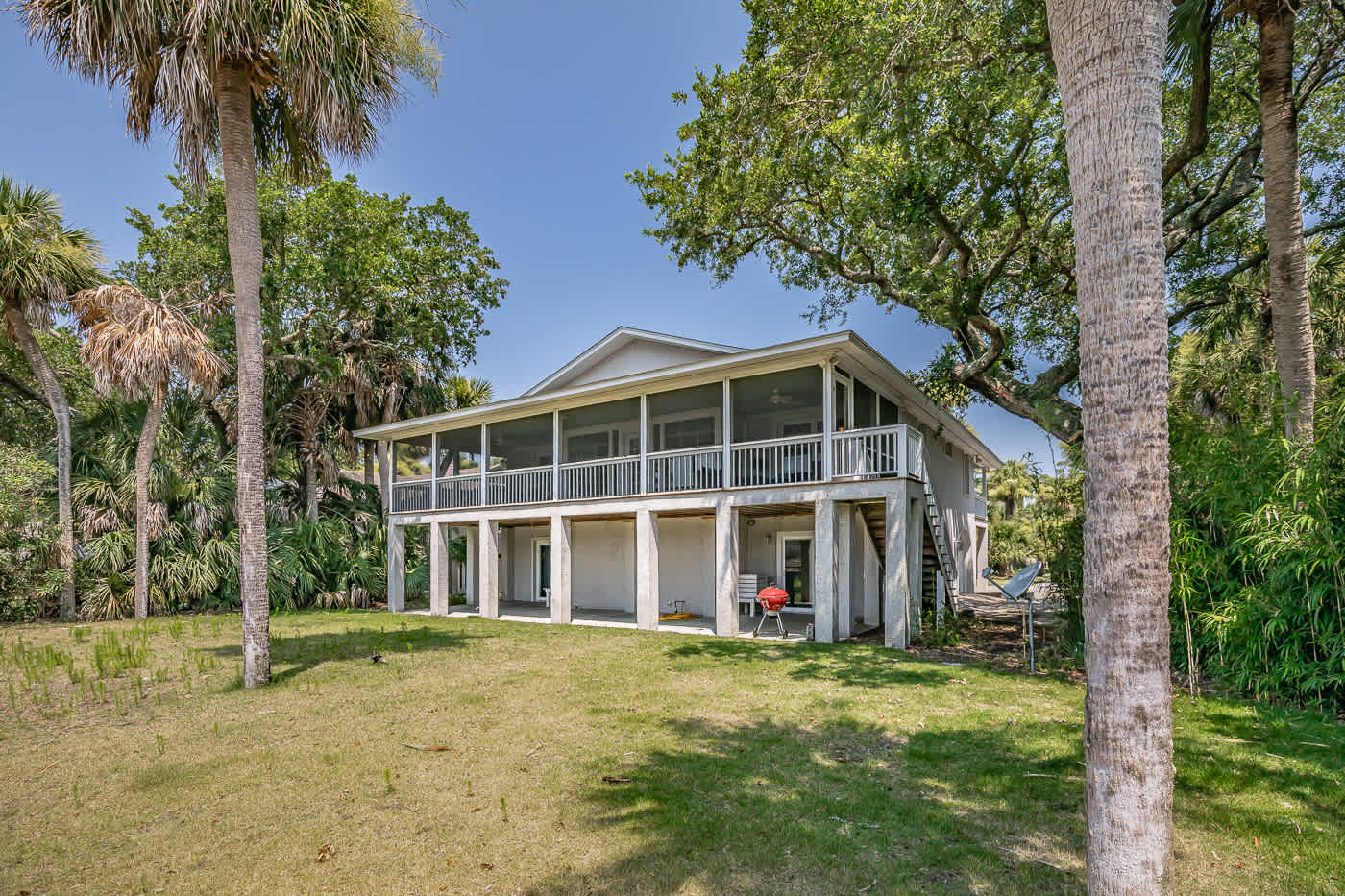 Back of the house with path to the dock