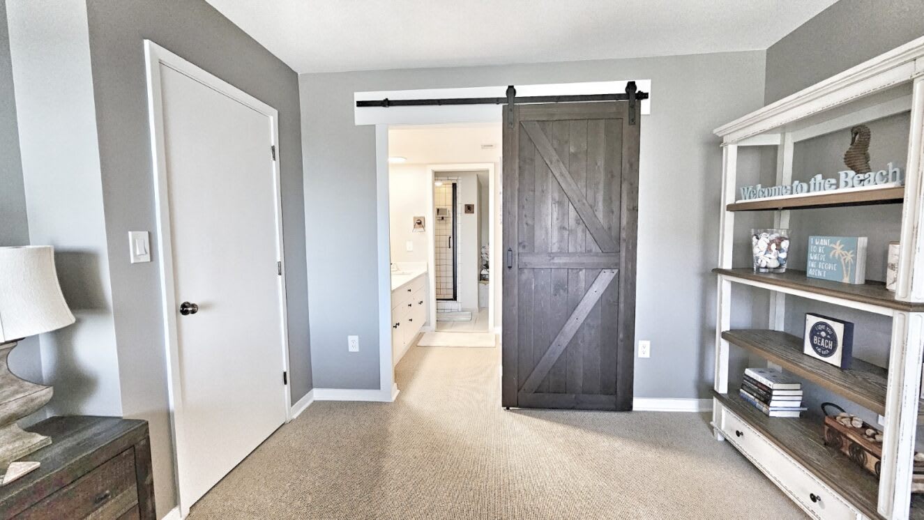First floor primary bedroom with en suite bathroom