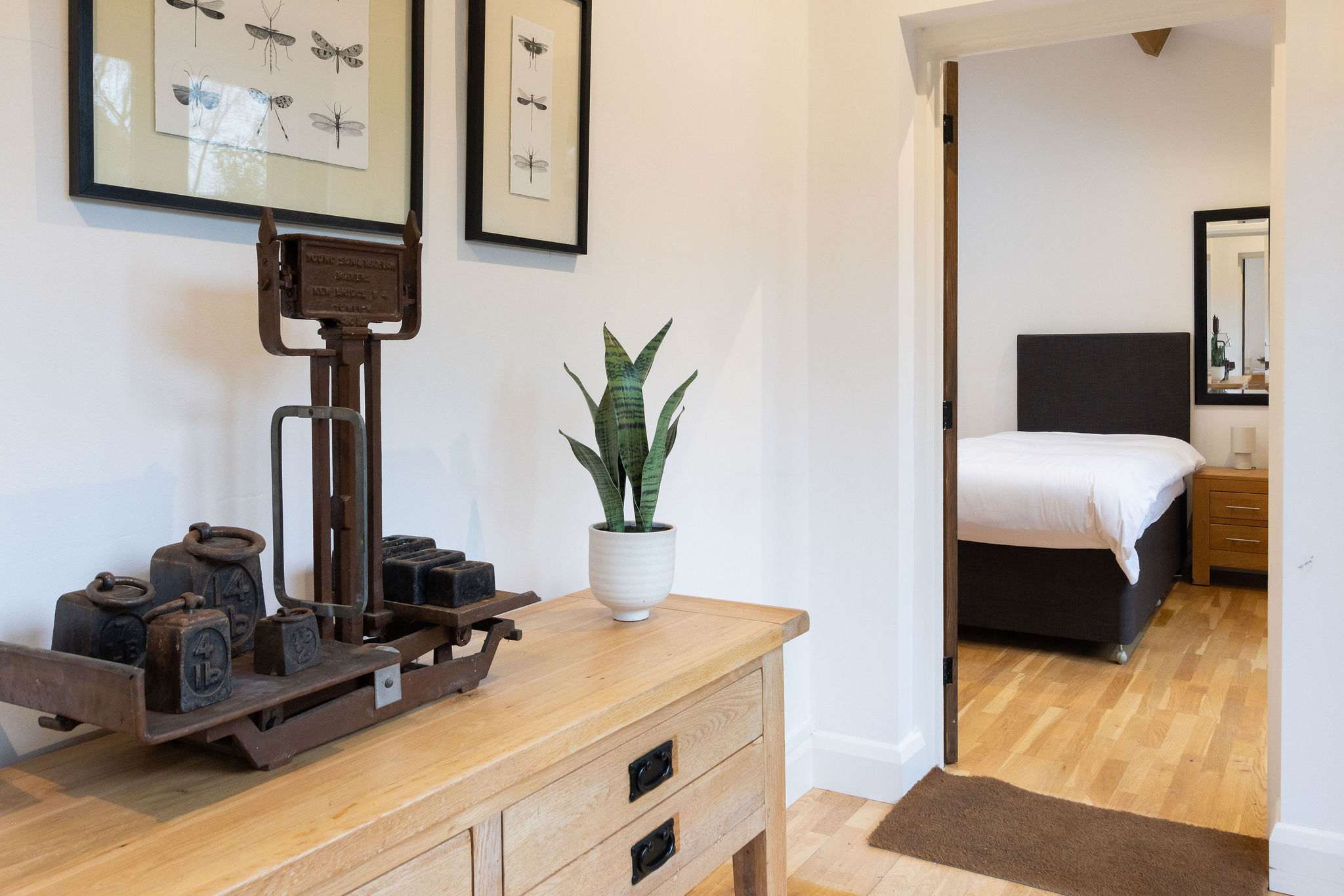 The bedroom leads off a shared entrance hall with another ensuite bedroom.