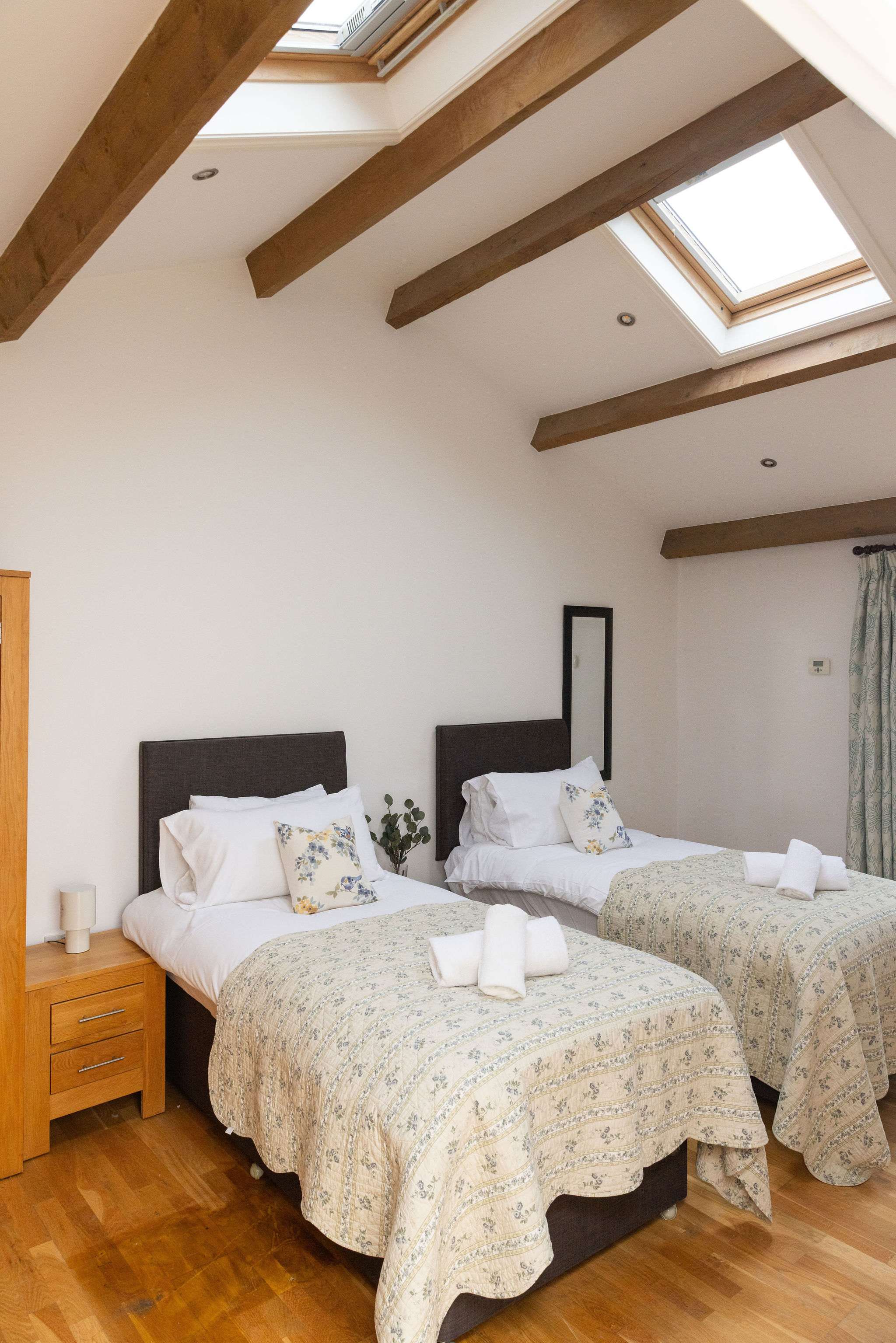 Vaulted ceilings and skylights give space and light to the room.