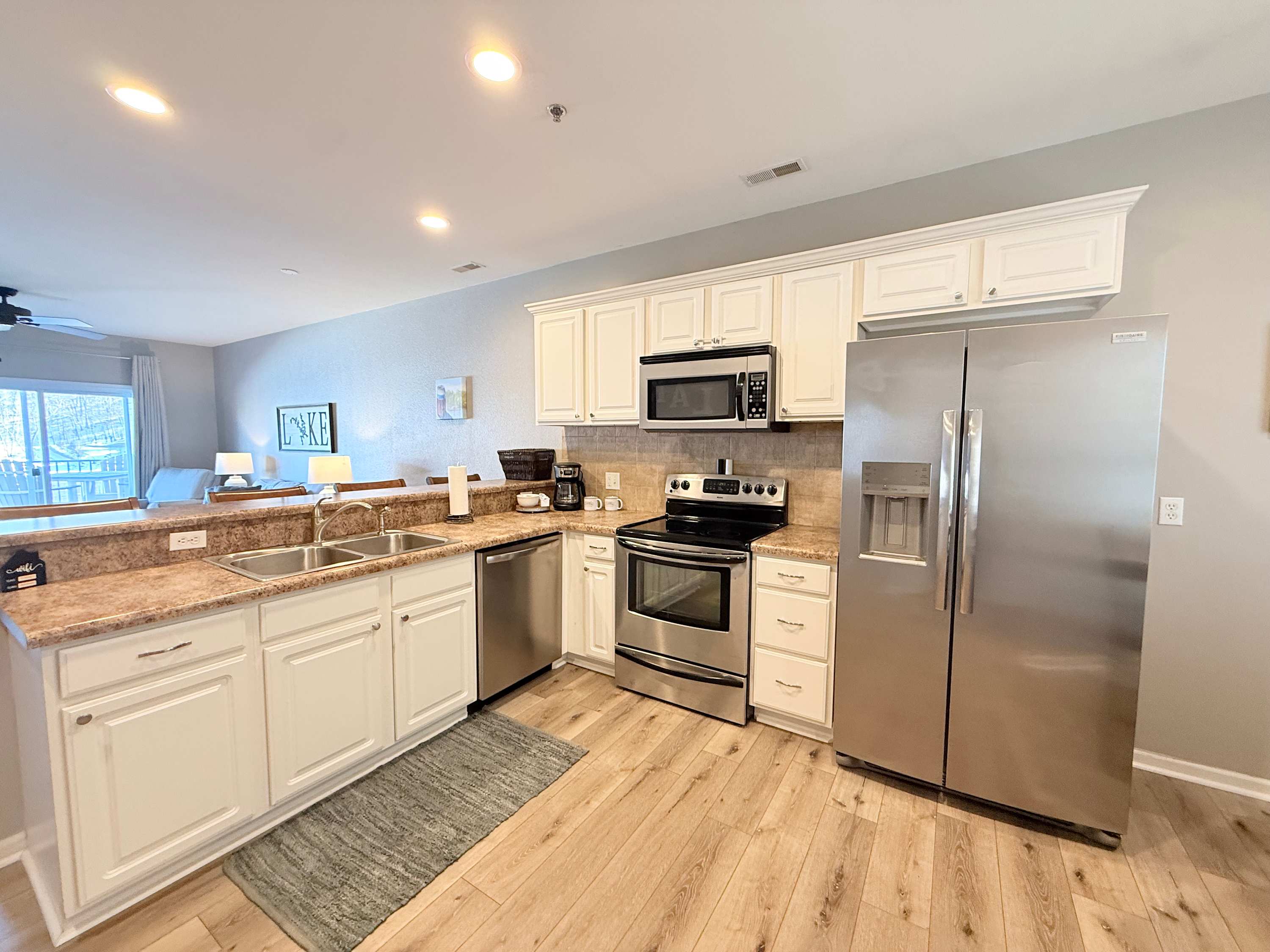 The open kitchen offers ample space & all the comforts of home​