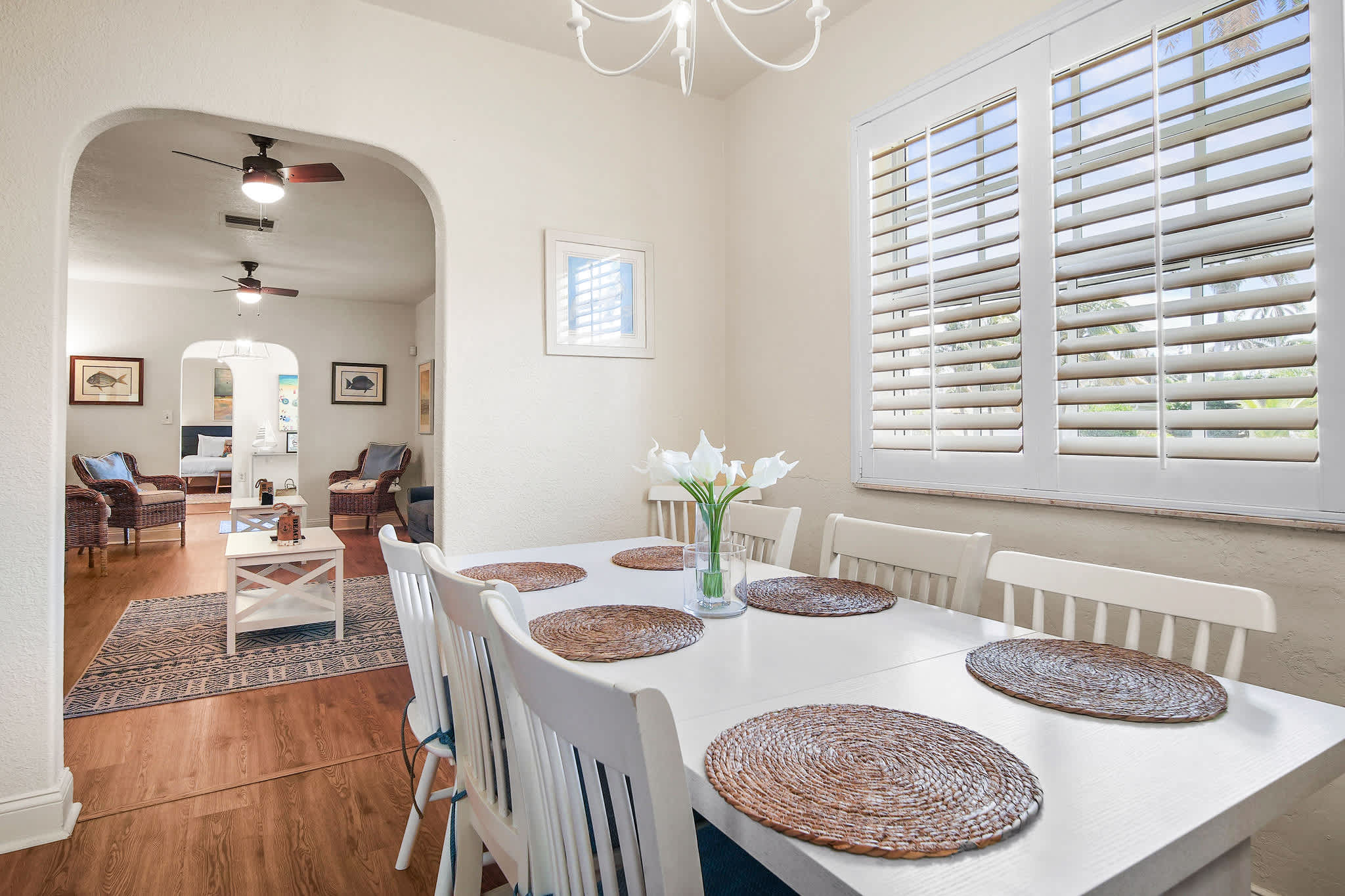 Bright and inviting dining area with seating for eight, perfect for family meals or gatherings.