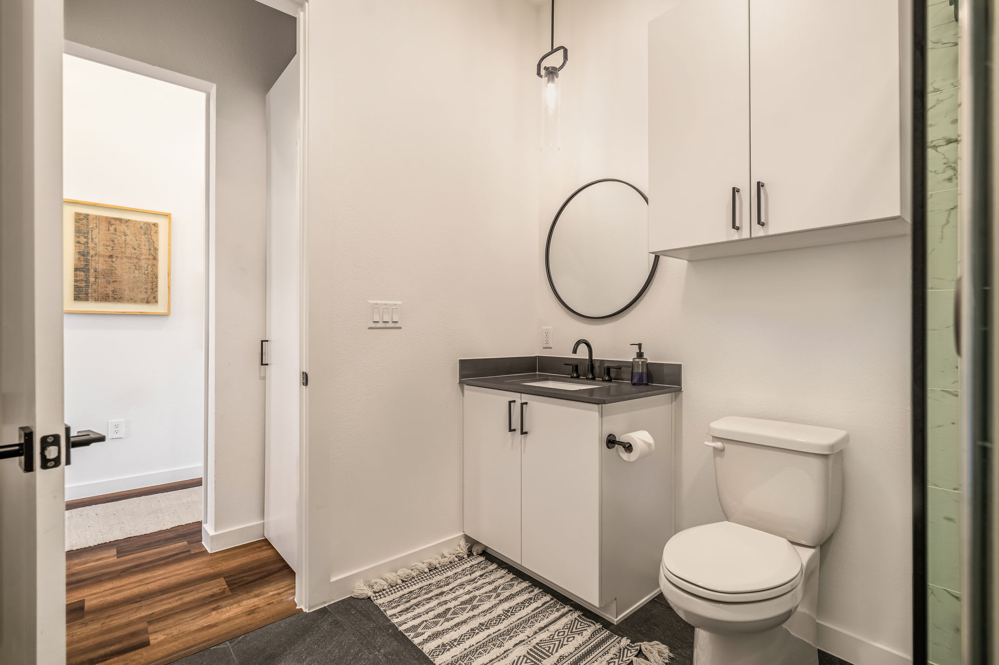 Bathroom vanity with round mirror