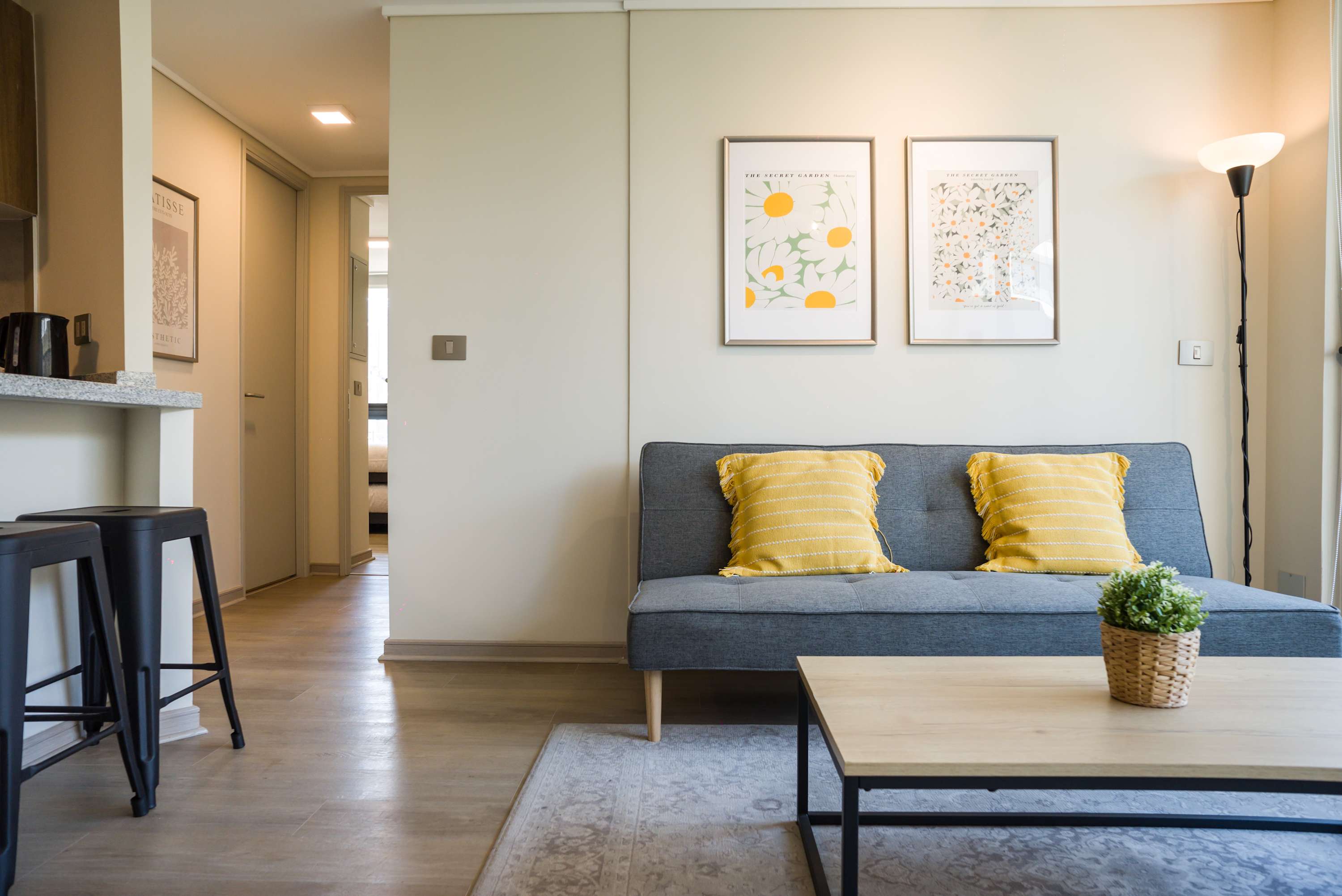 Relax in this cozy living room with stylish decor and natural light, perfect for unwinding after a day of exploring.