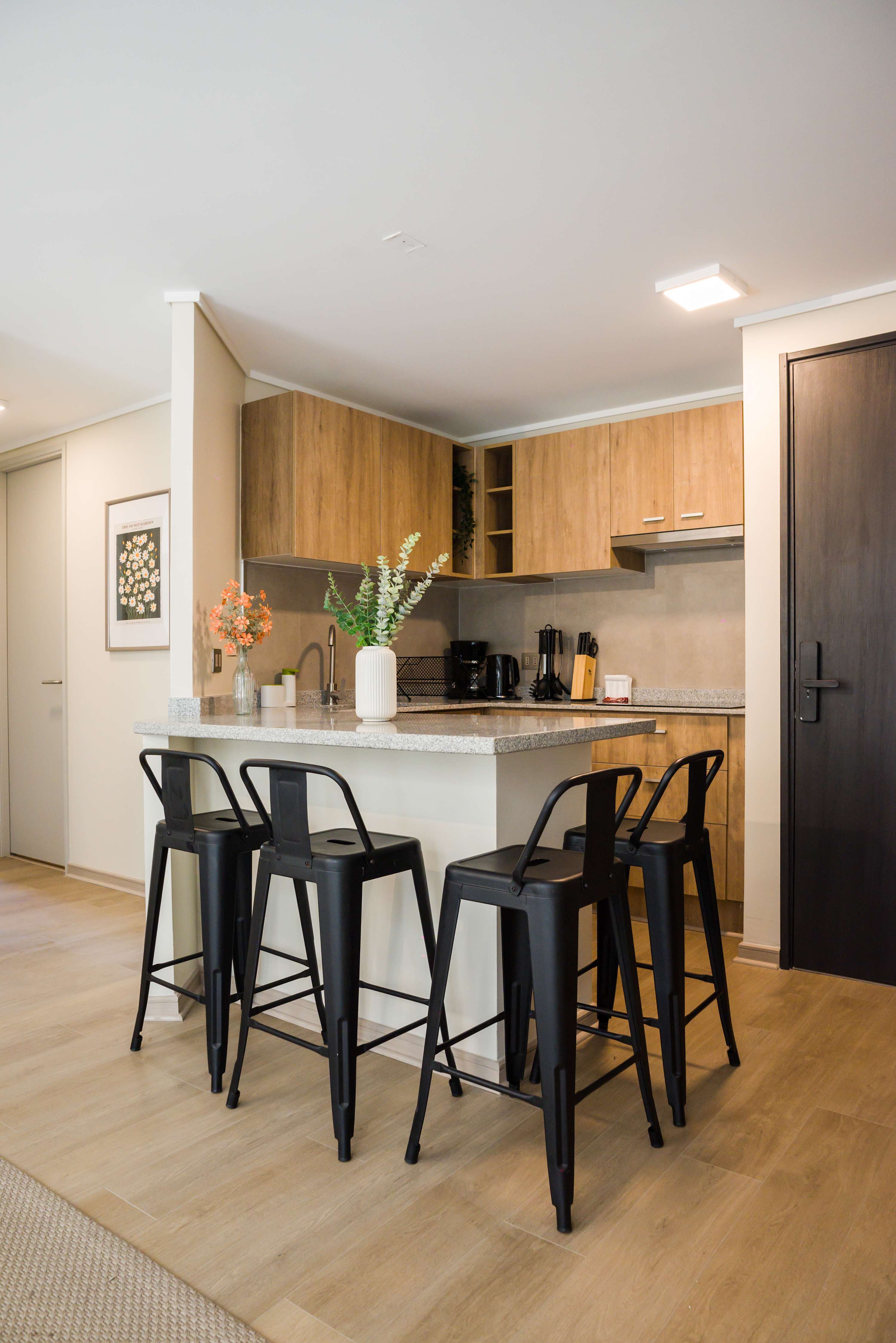 Stylish kitchen with sleek bar seating and modern amenities, perfect for casual dining and entertaining.