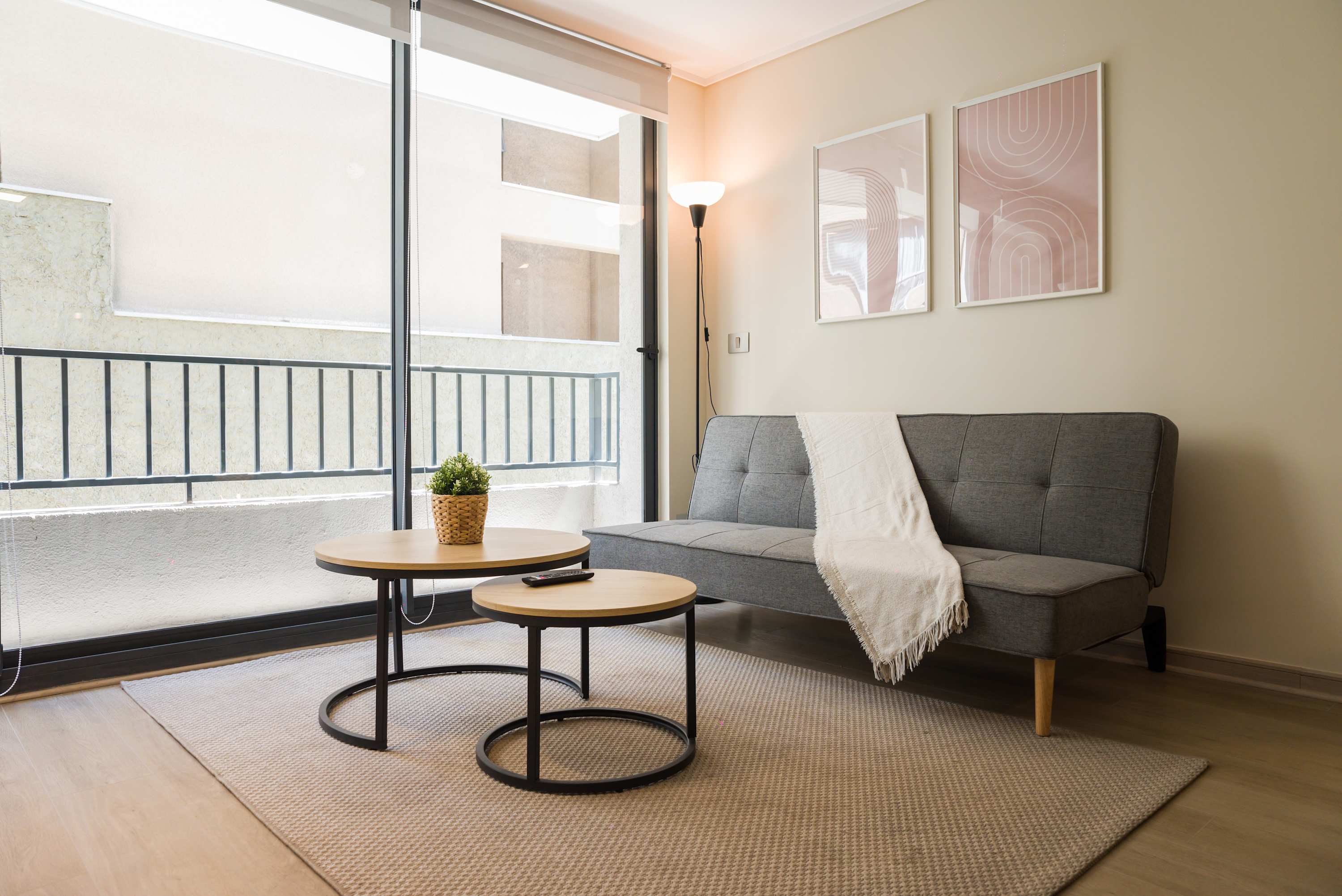 Relax in this cozy living area with natural light and modern decor, perfect for unwinding after a day of exploring.