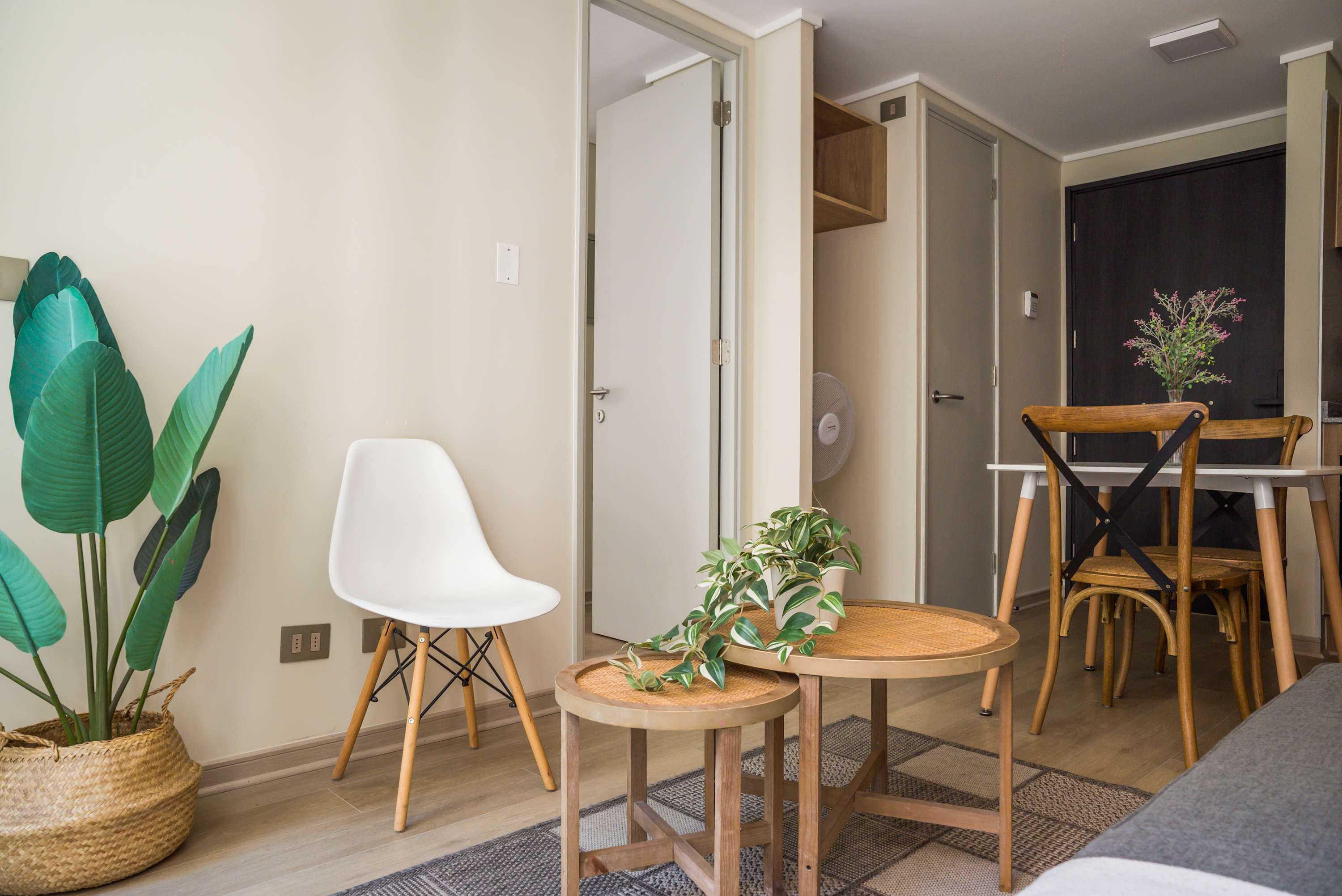 Cozy living area with stylish furniture and natural light, perfect for relaxation.