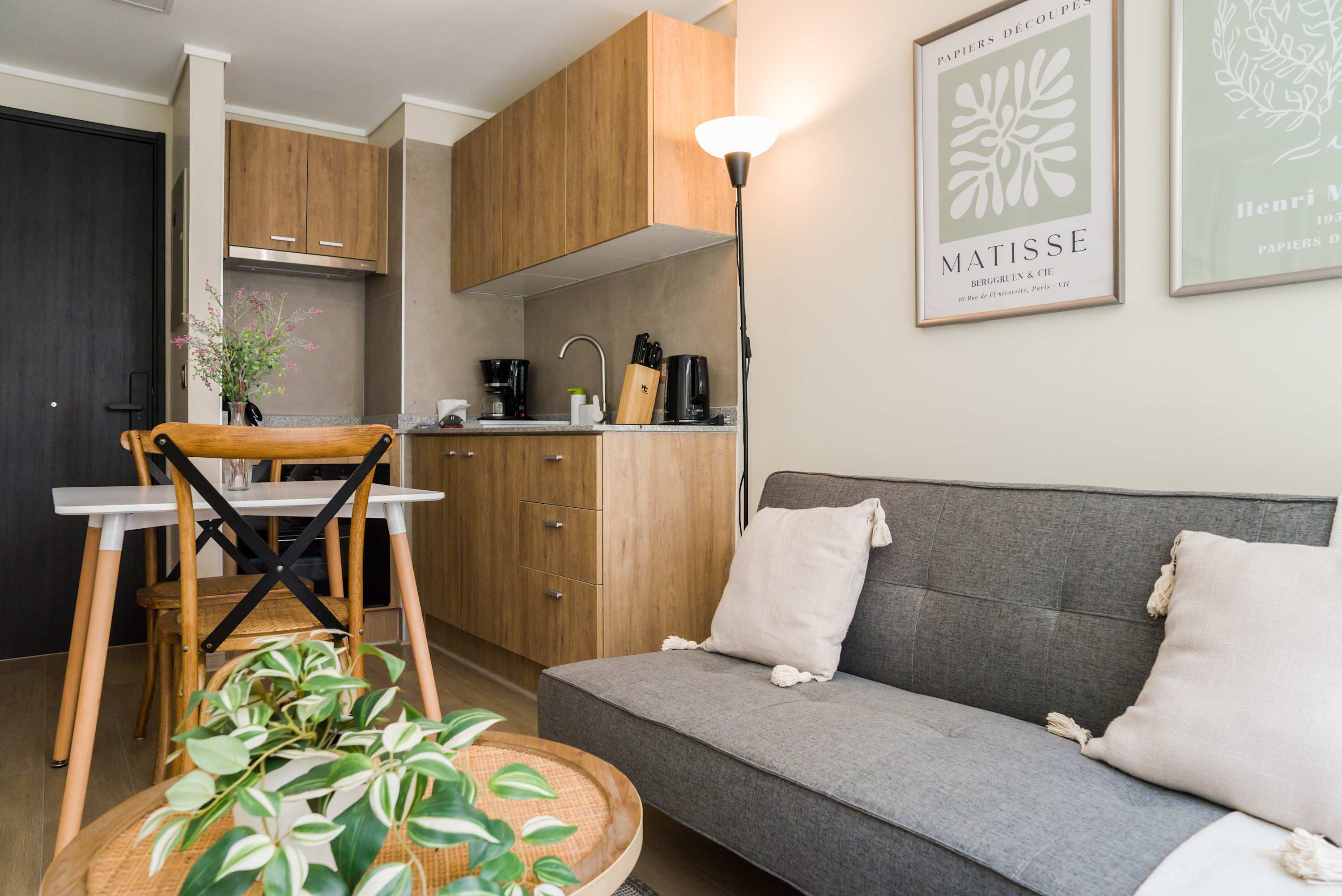 Cozy studio with a stylish living area and compact kitchen, perfect for a comfortable stay in the heart of the city.