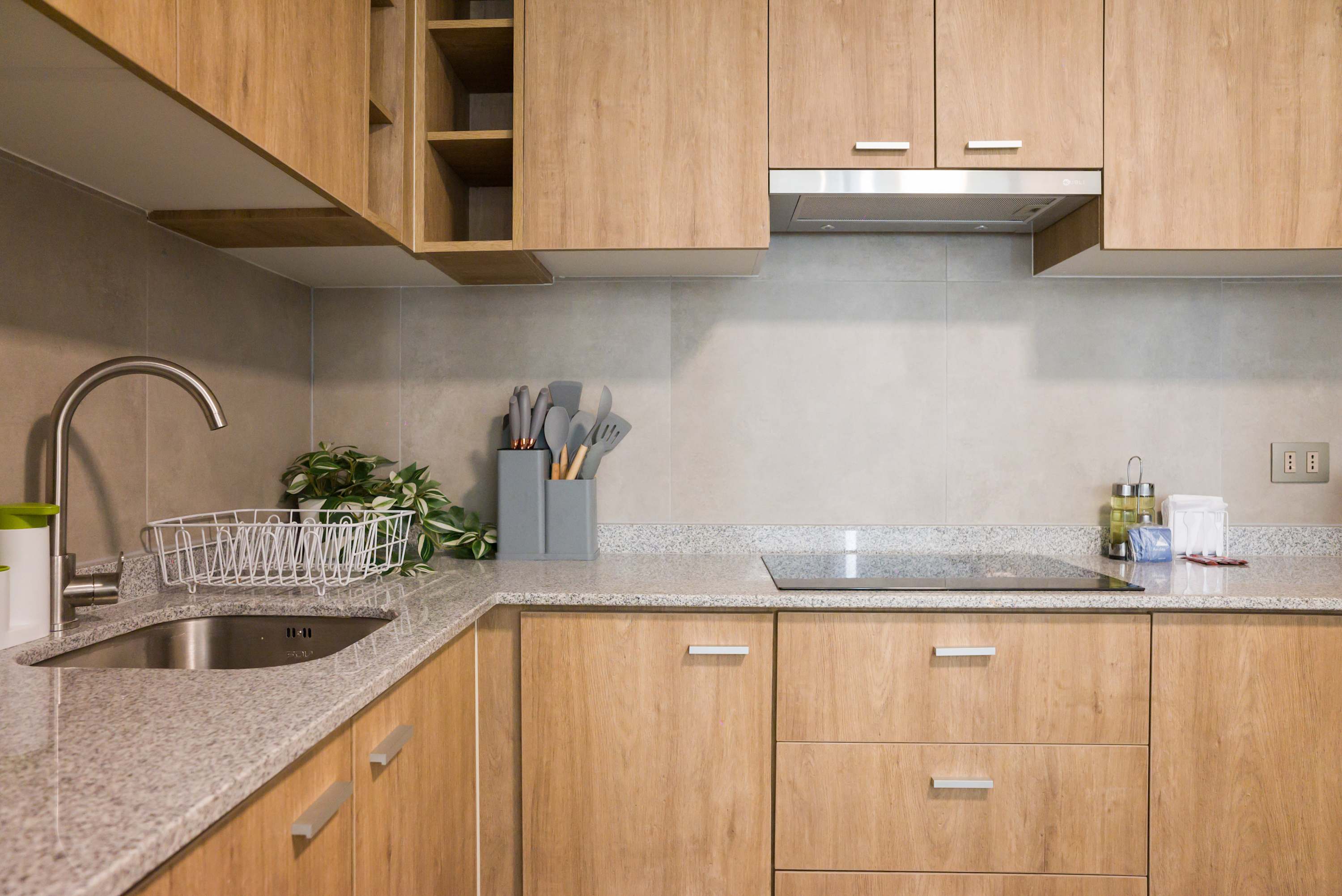 Modern kitchen with sleek wood cabinets and granite countertops, perfect for culinary adventures.