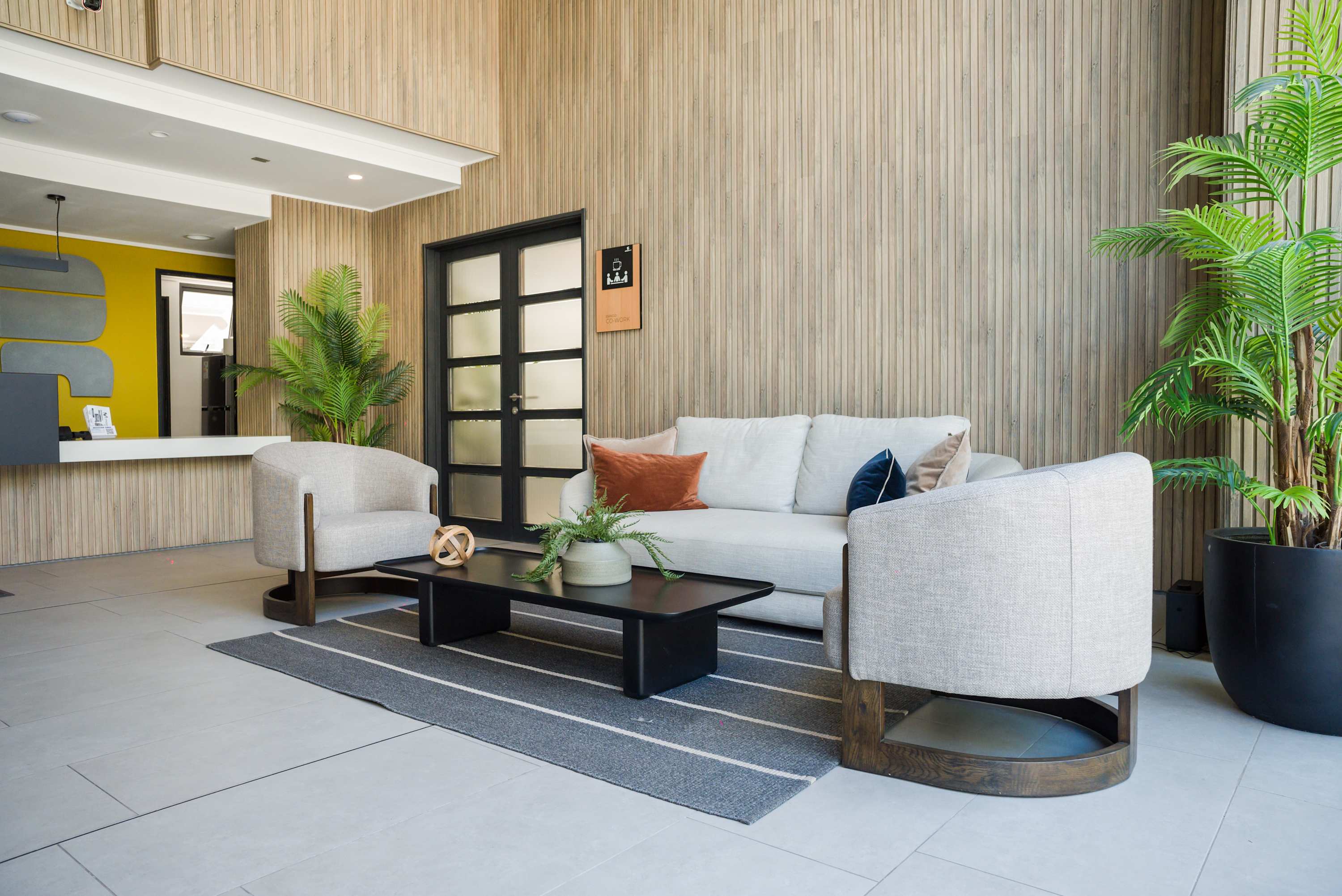 Relax in this stylish lounge area featuring cozy seating and modern decor.