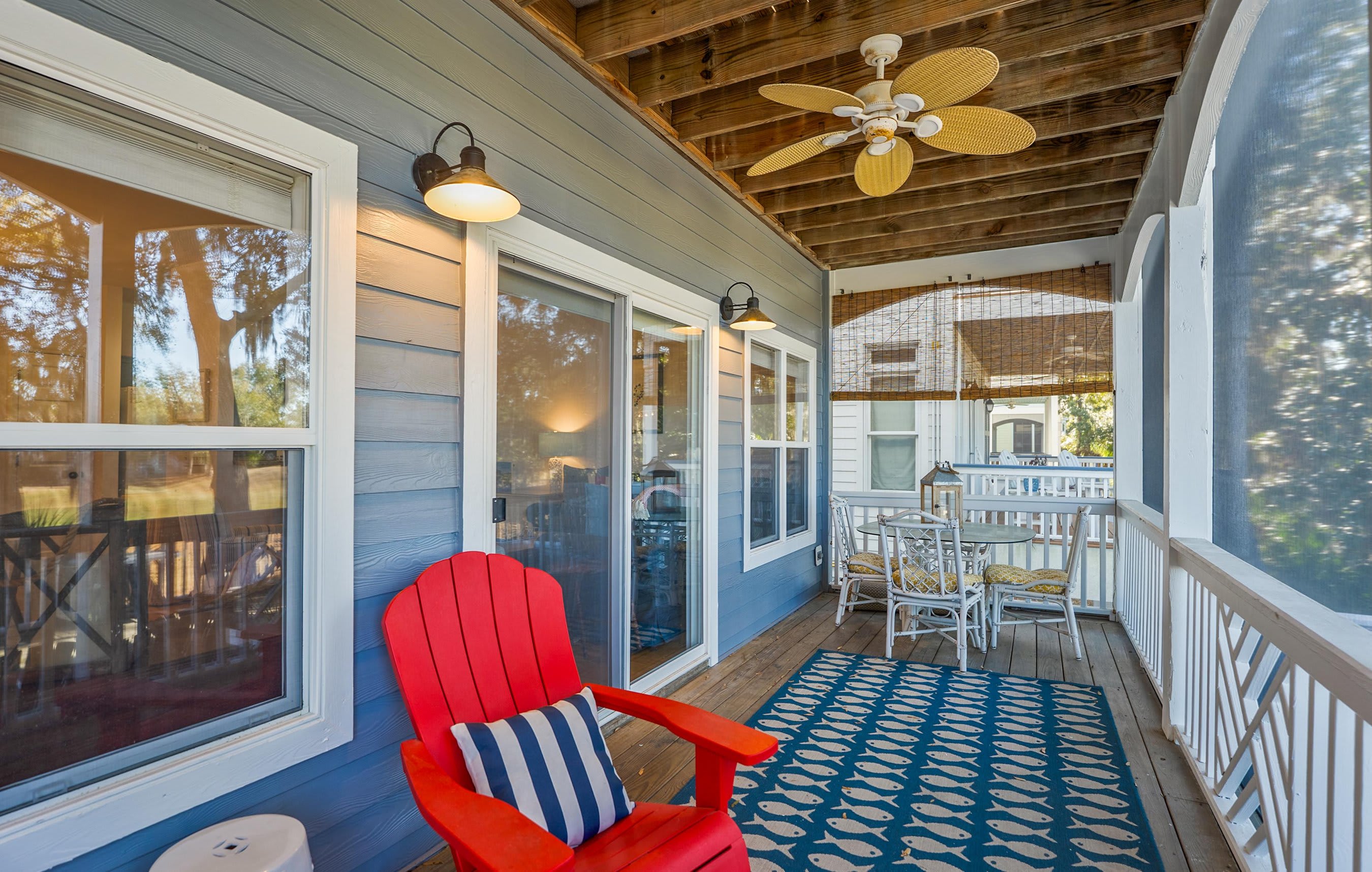 Two Tier Back Deck. Features an Outdoor Sectional, a Teak Dining Table and Both Gas and Charcoal Grills.
