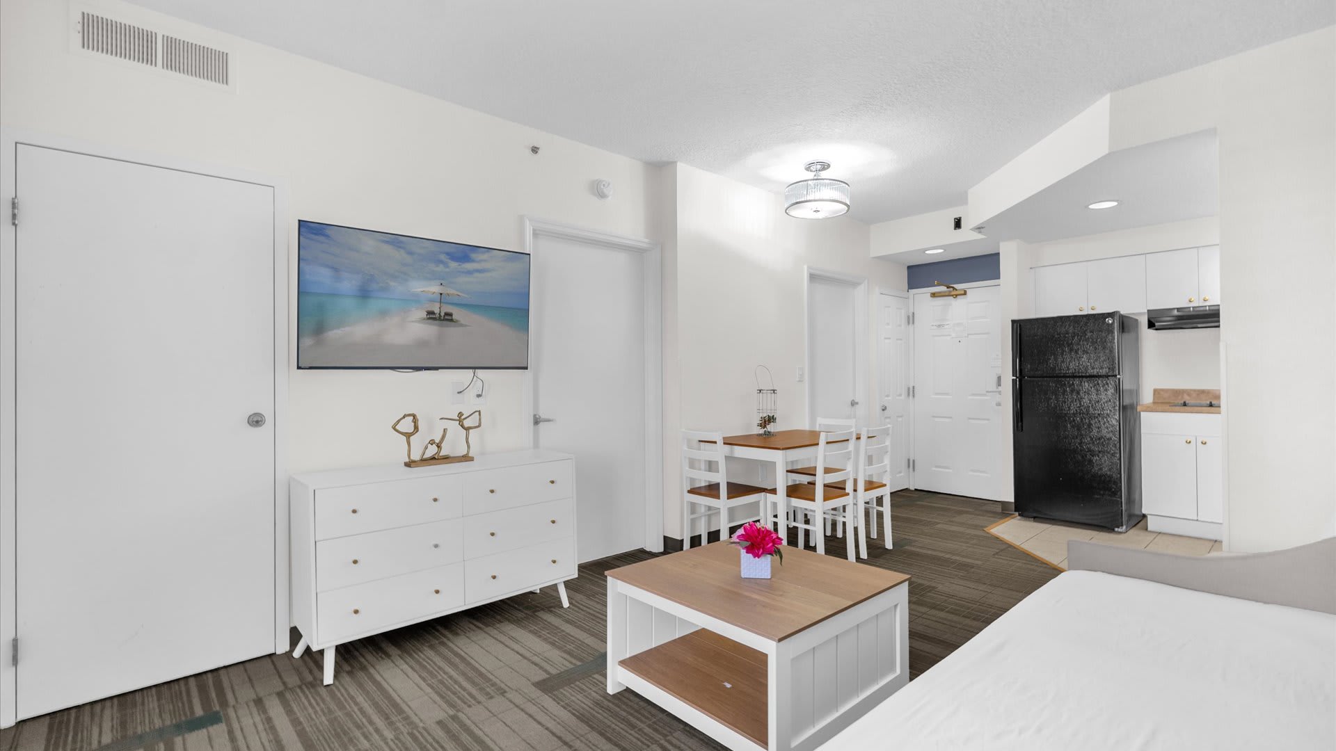 Spacious living space with dining + kitchen nearby