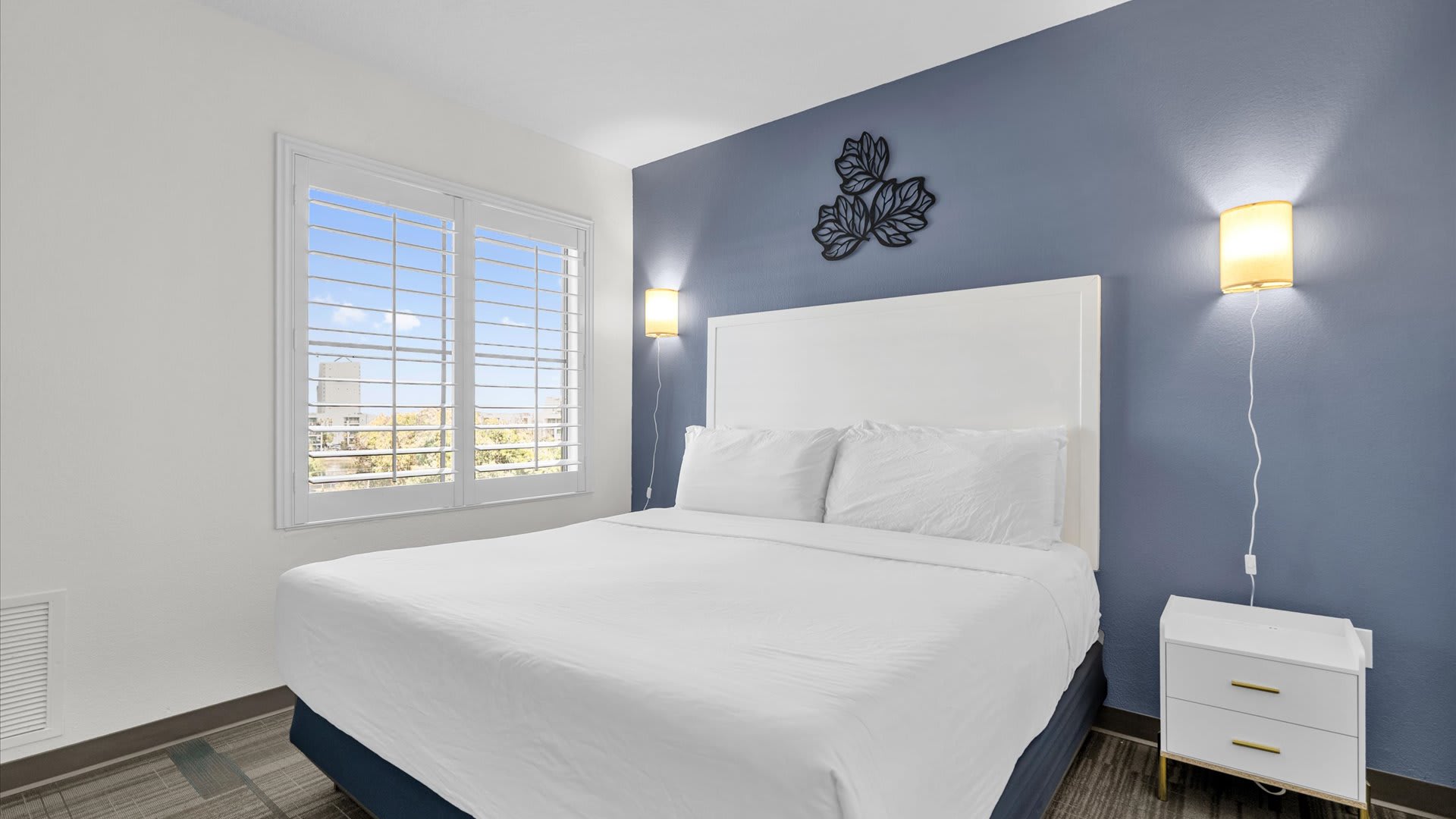 Comfortable bedroom with crisp linens and a king size bed