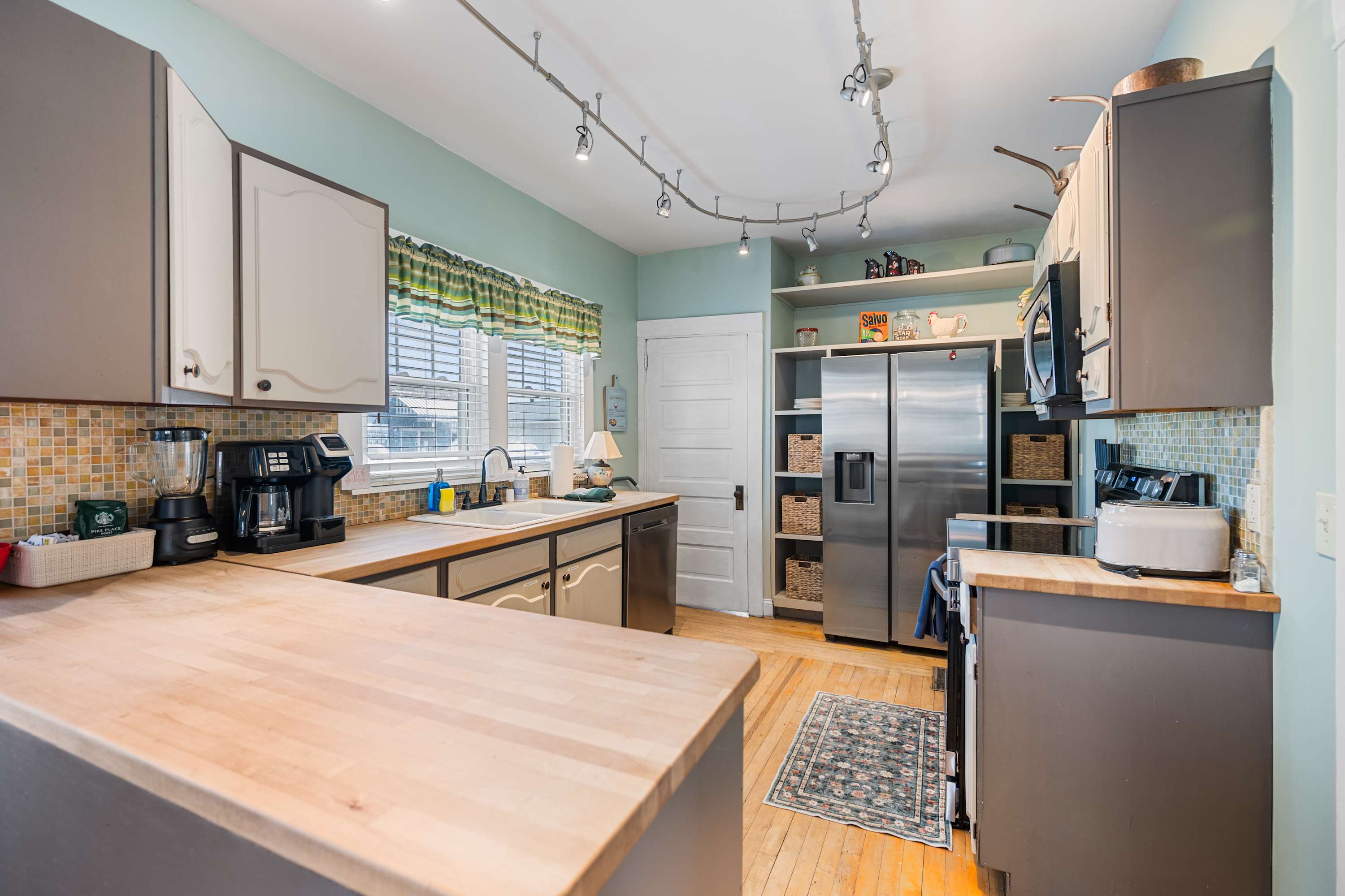 The open kitchen offers ample space & all the comforts of home​