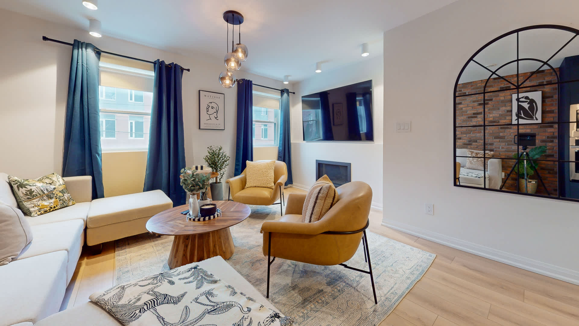 Open-Concept Space - Brick accents, warm tones, and space to gather.