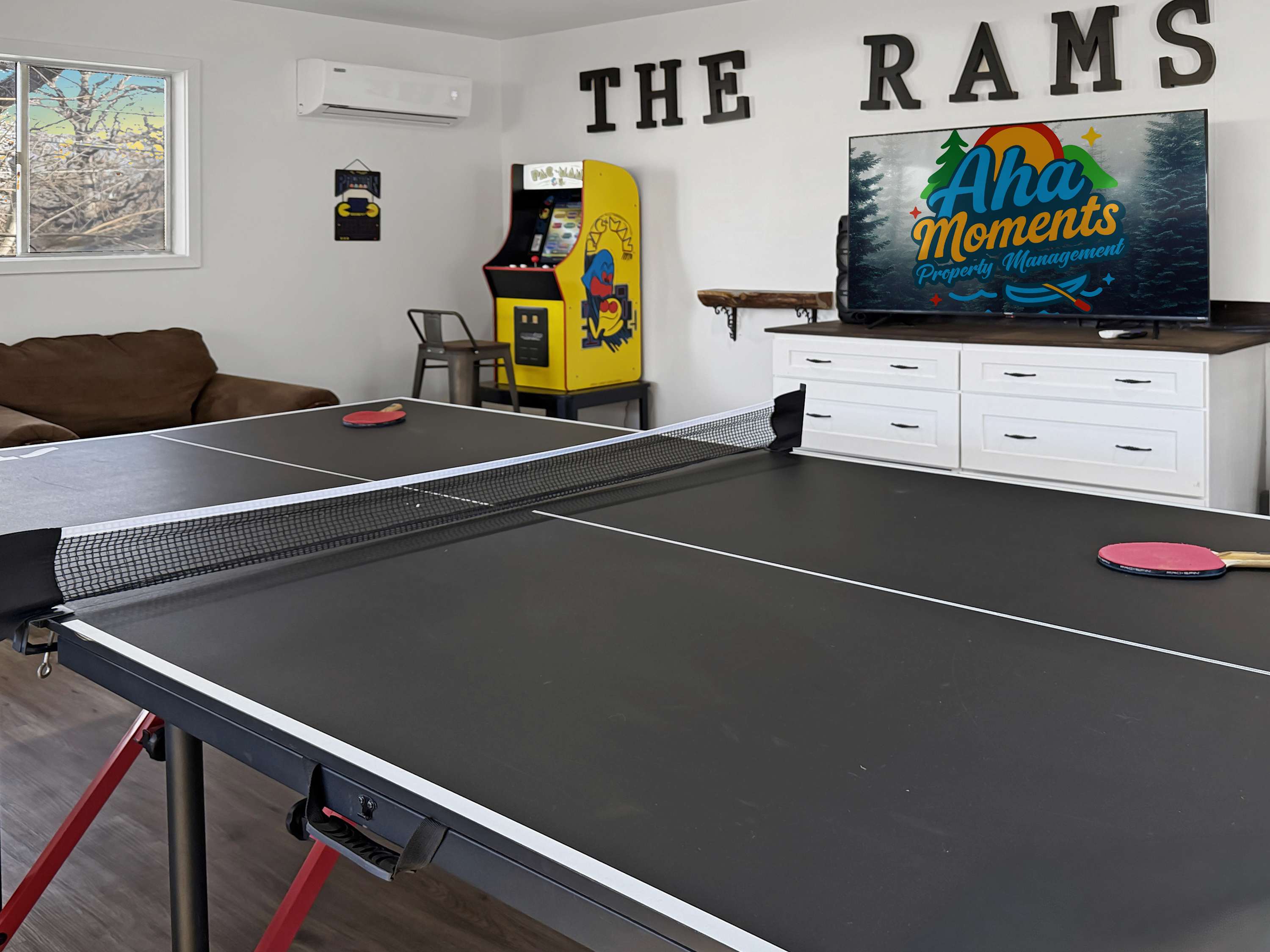 Super Fun ping pong table and video game at Rams Den 1 in the giant game room