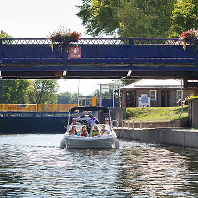 Boating through the Trent-Severn Waterway at Lock 32 — A quintessential Bobcaygeon summer experience.
