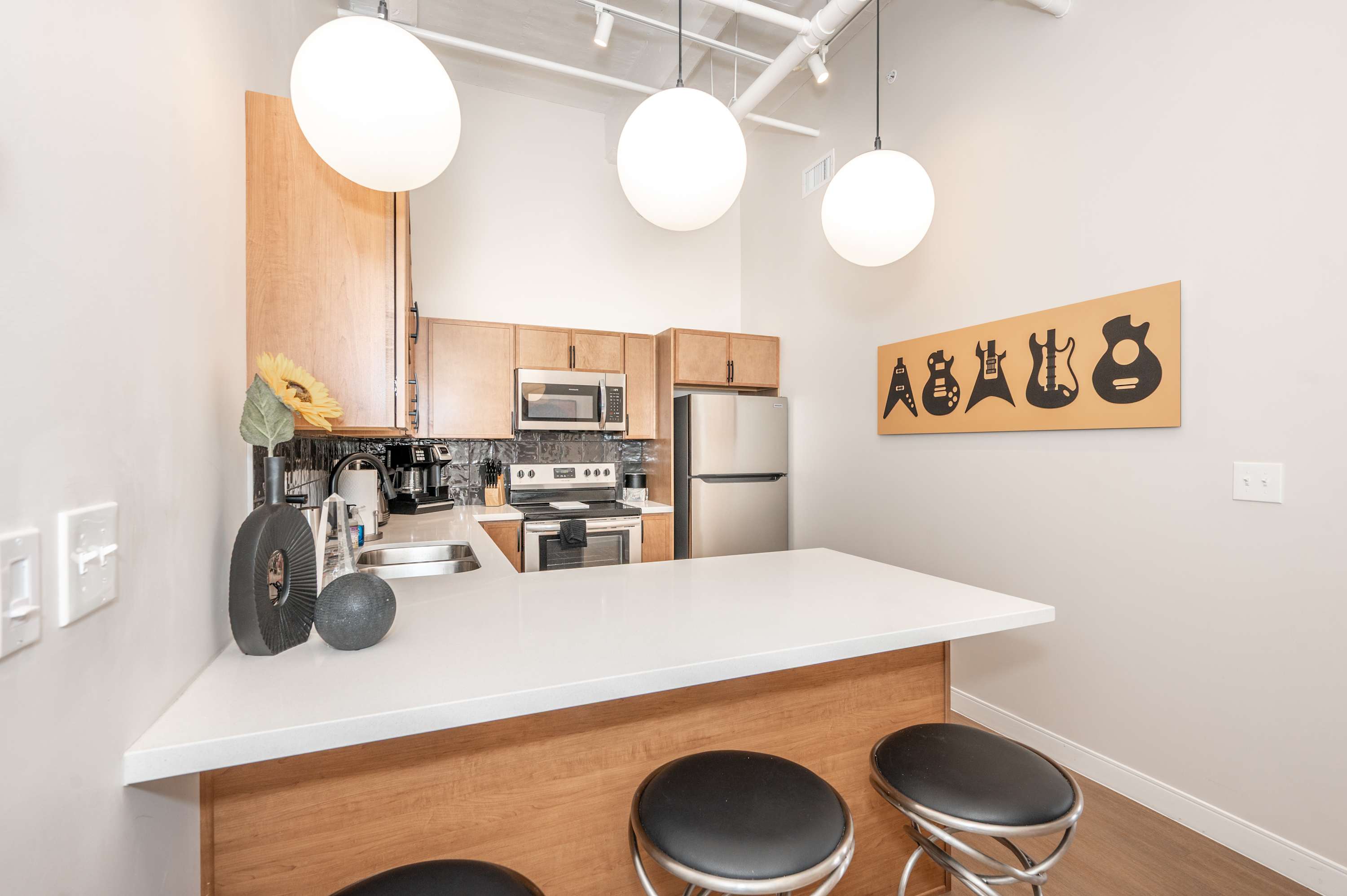 Suite 303’s inviting kitchen offers ample space & all the comforts of home​