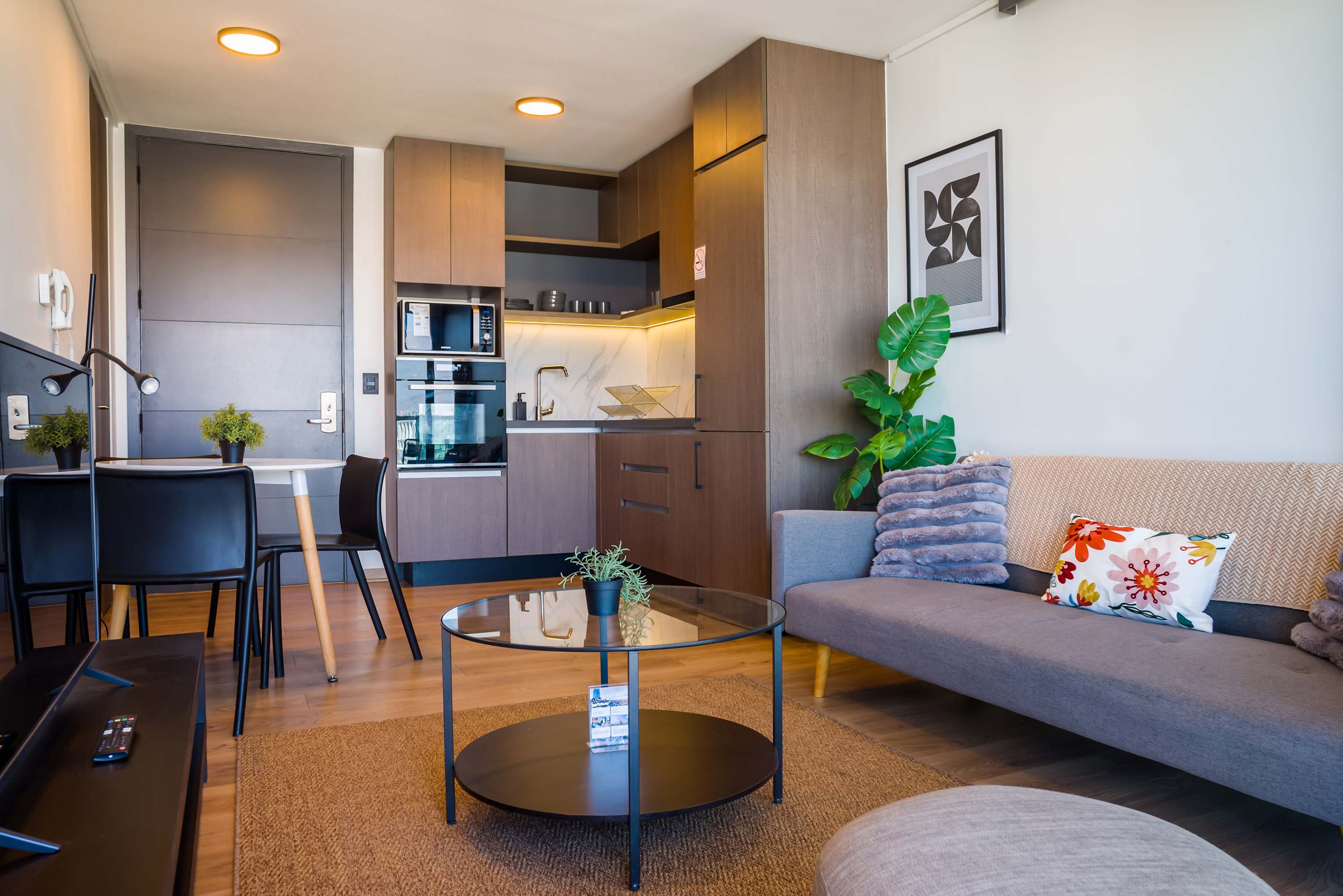 Cozy and stylish living space with a modern kitchen, perfect for relaxing after exploring the city.