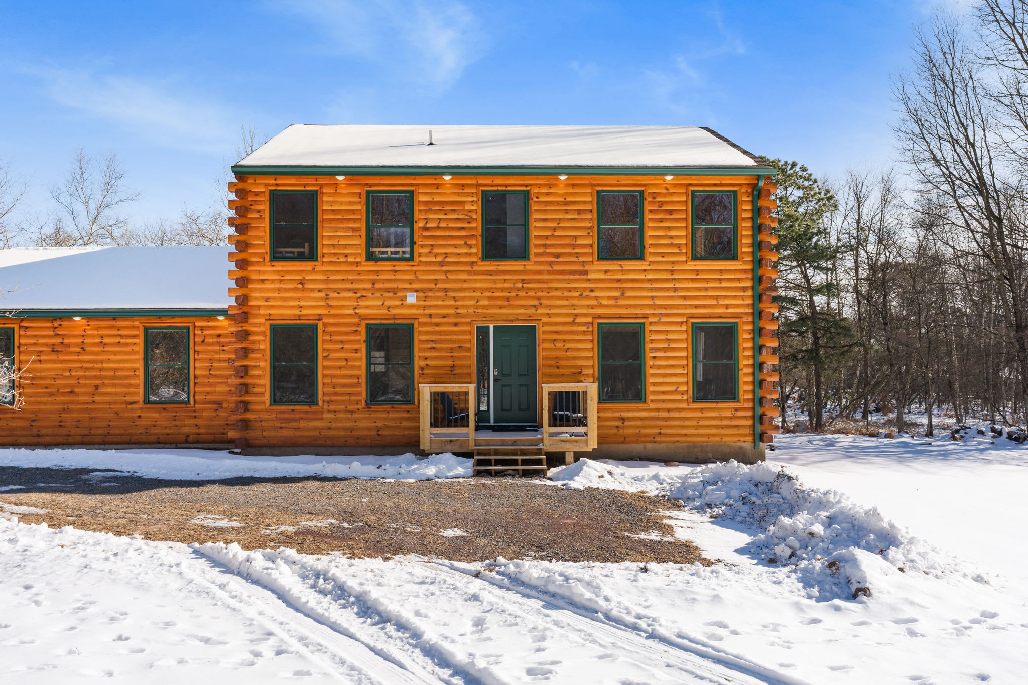Your Poconos getaway awaits at this beautiful log cabin surrounded by nature
