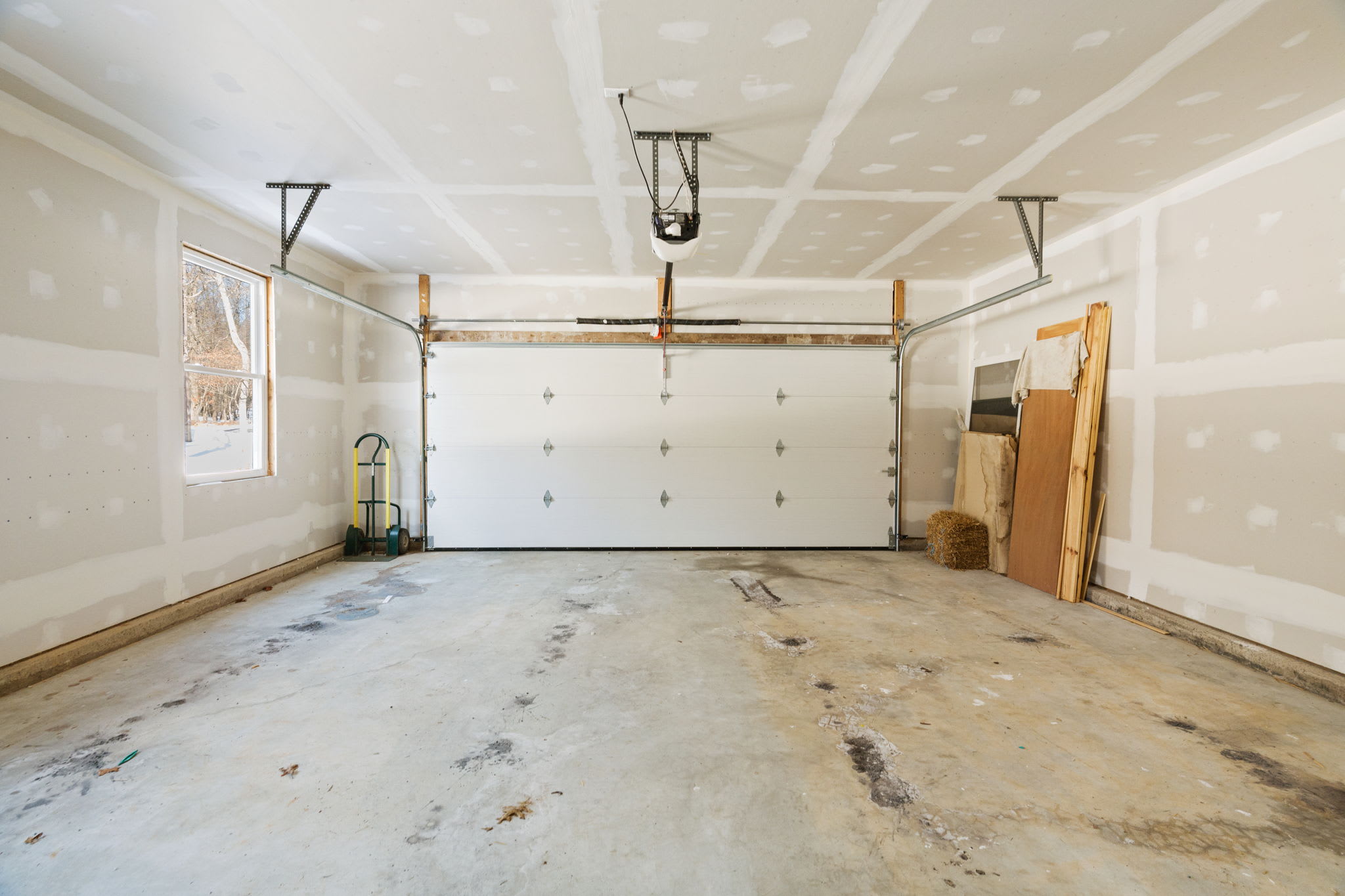 The spacious attached garage provides covered parking and extra storage space