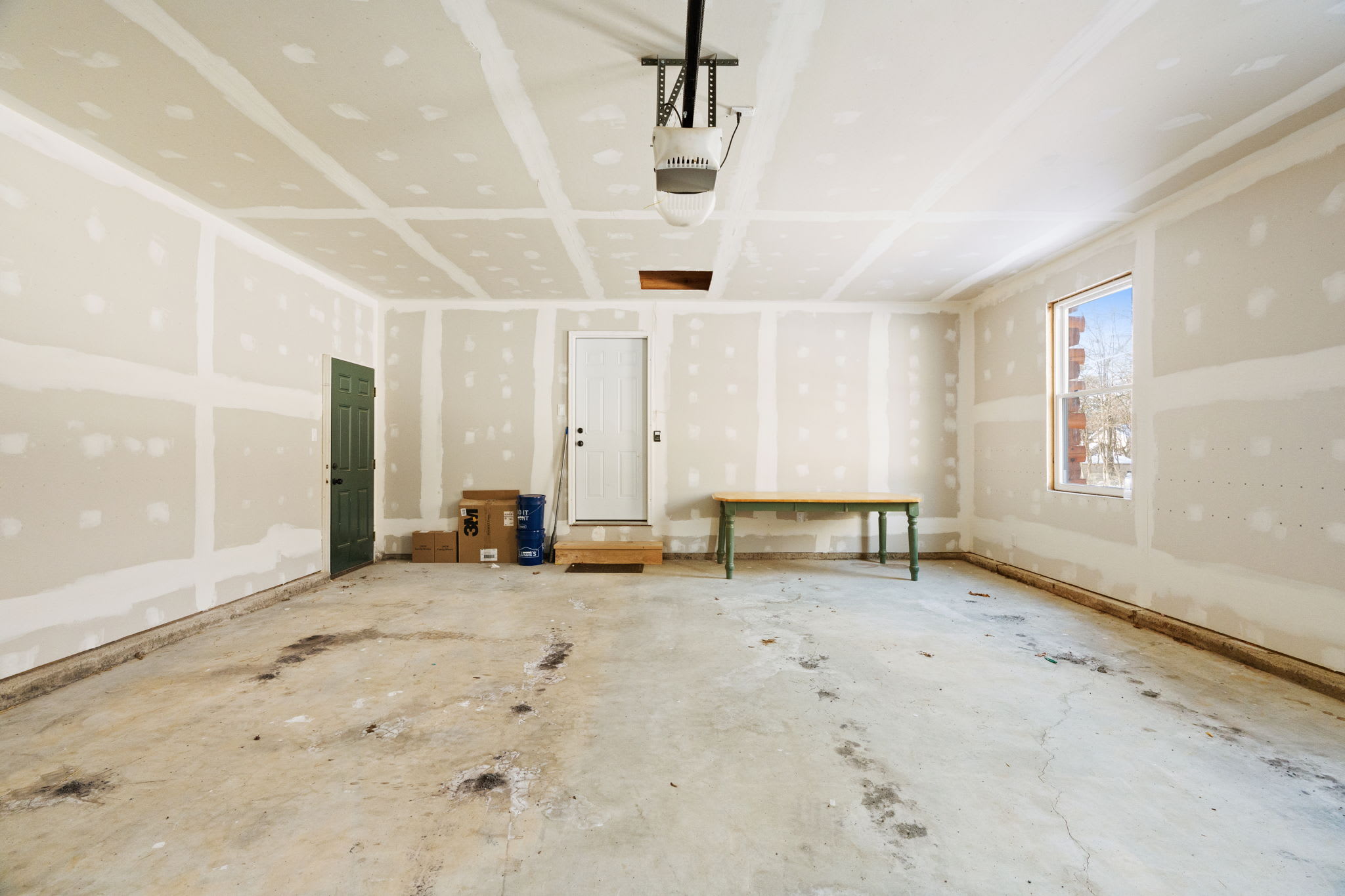 Additional lower-level space offers room for gear storage and extra parking