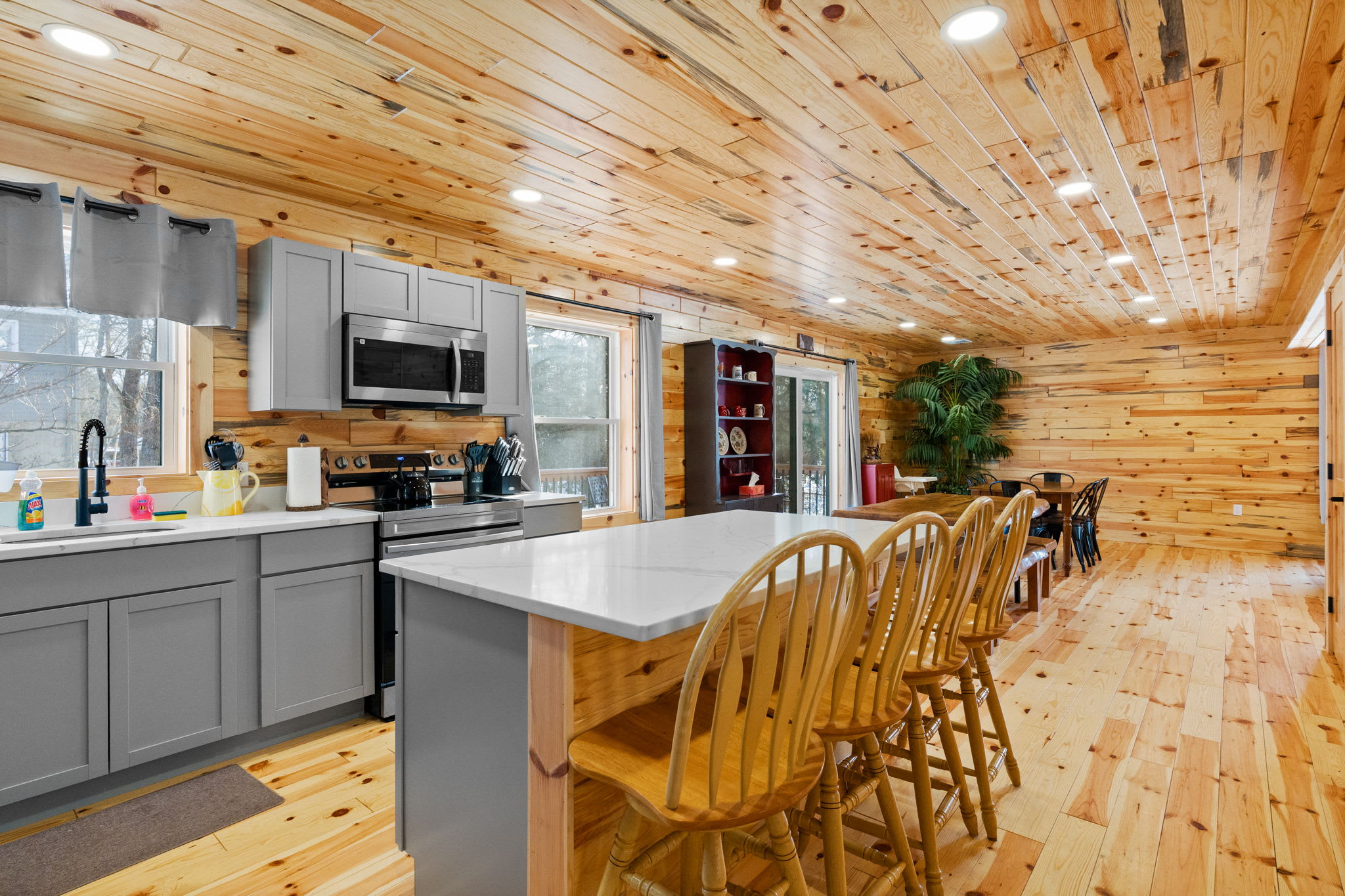 The open-concept kitchen flows into the dining area with room for everyone to gather