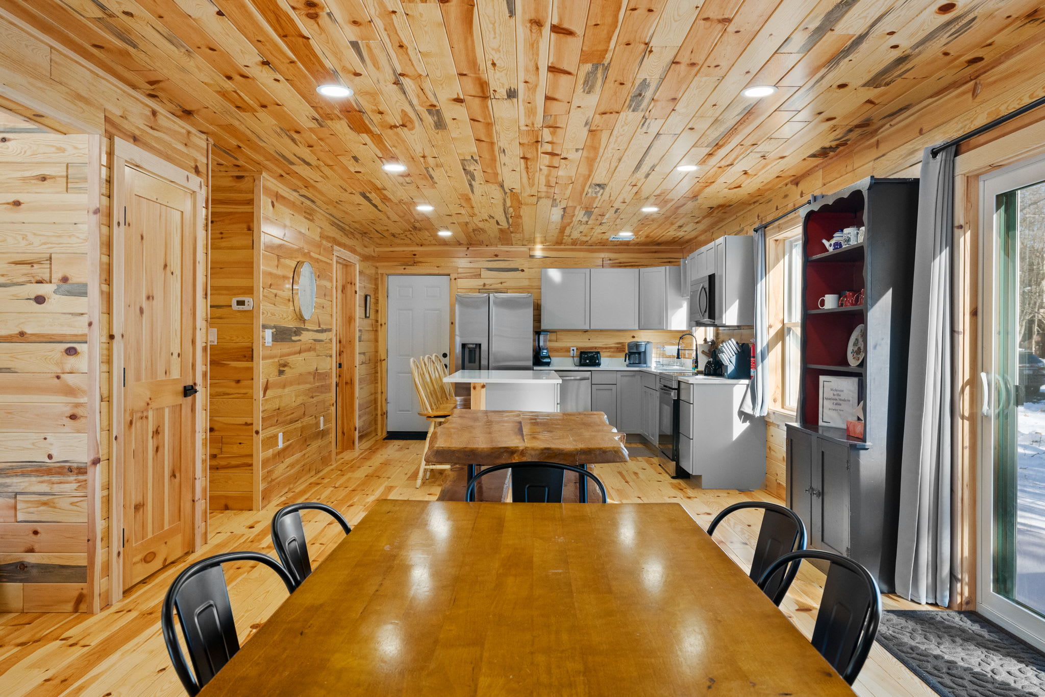A beautiful live-edge dining table with bench seating adds rustic cabin charm