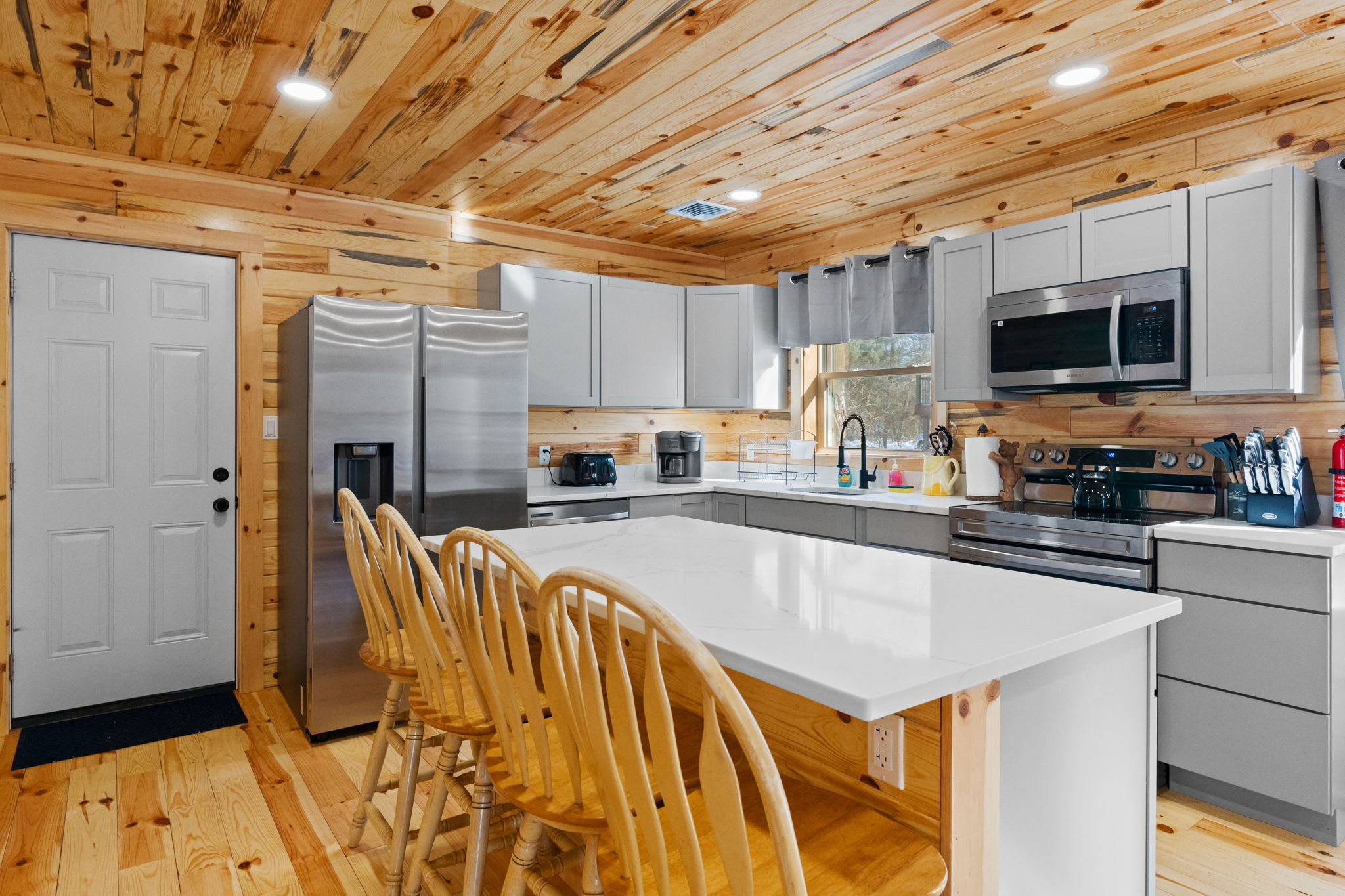 Cook together in the spacious kitchen with a large island, bar seating, and stainless steel appliances