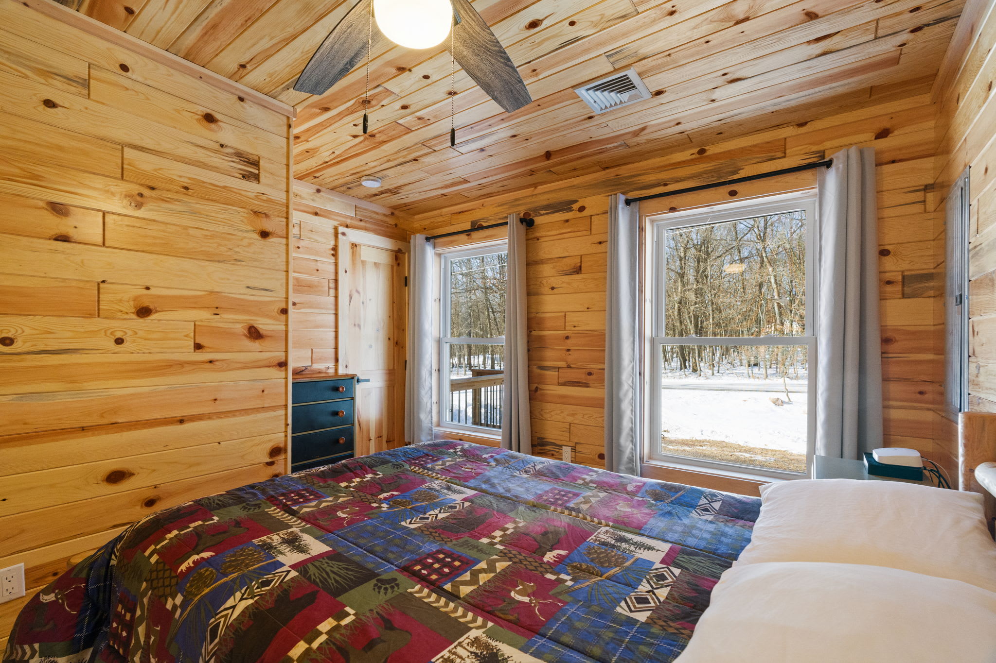 Wake up to snowy views right from bed with the sliding door leading to the deck