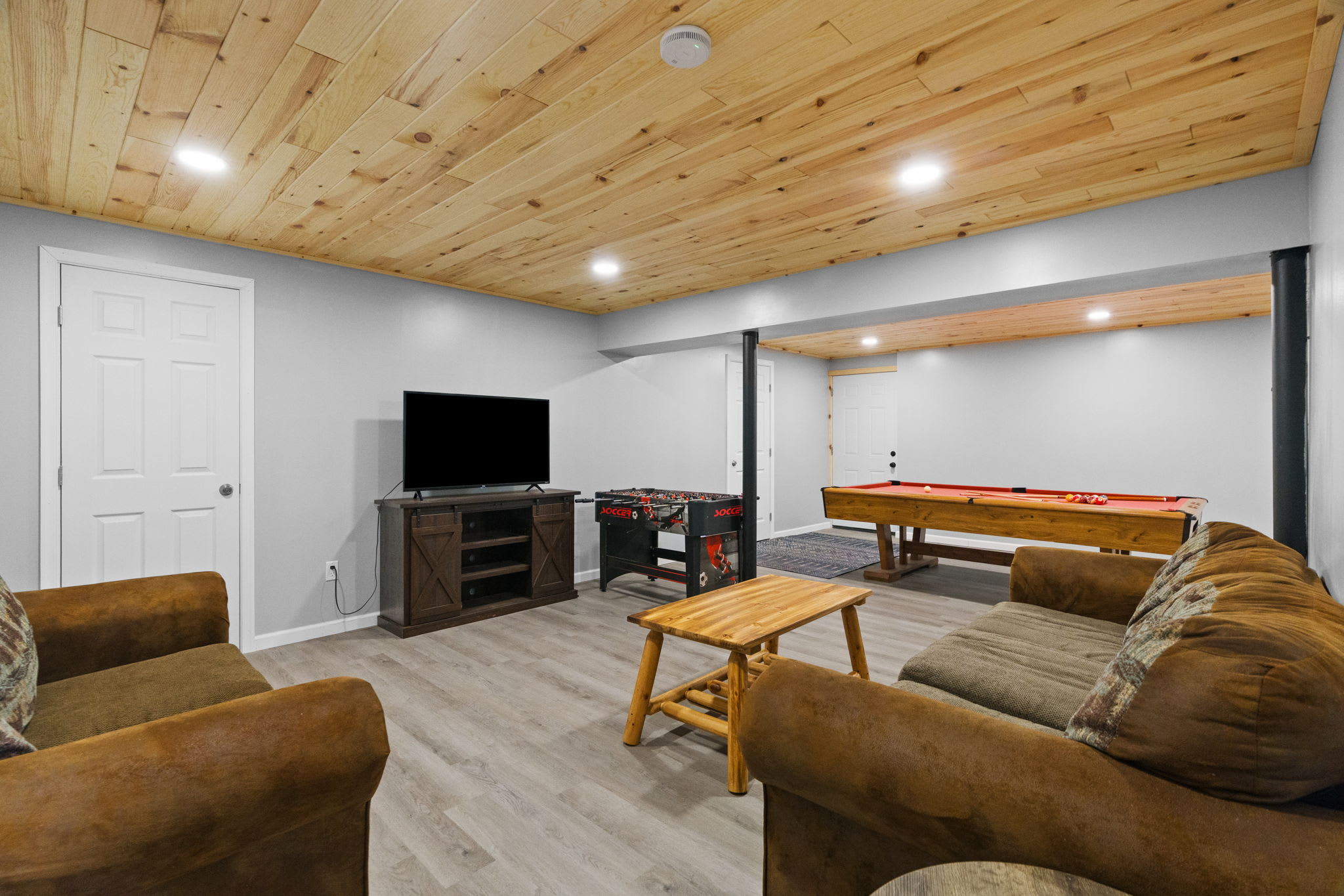 Kick back in the game room with comfy sofas, a TV, and pool table close by