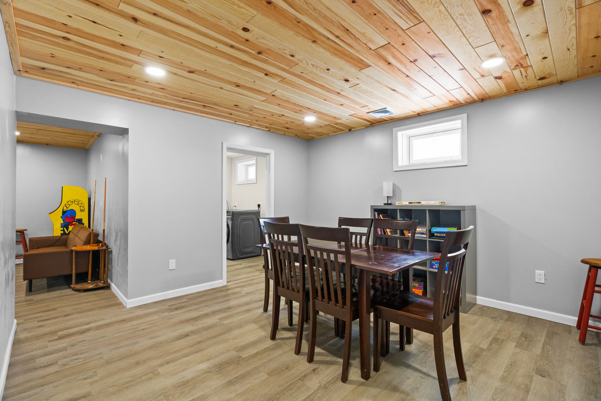 A cozy reading nook and game shelves make the lower level great for downtime