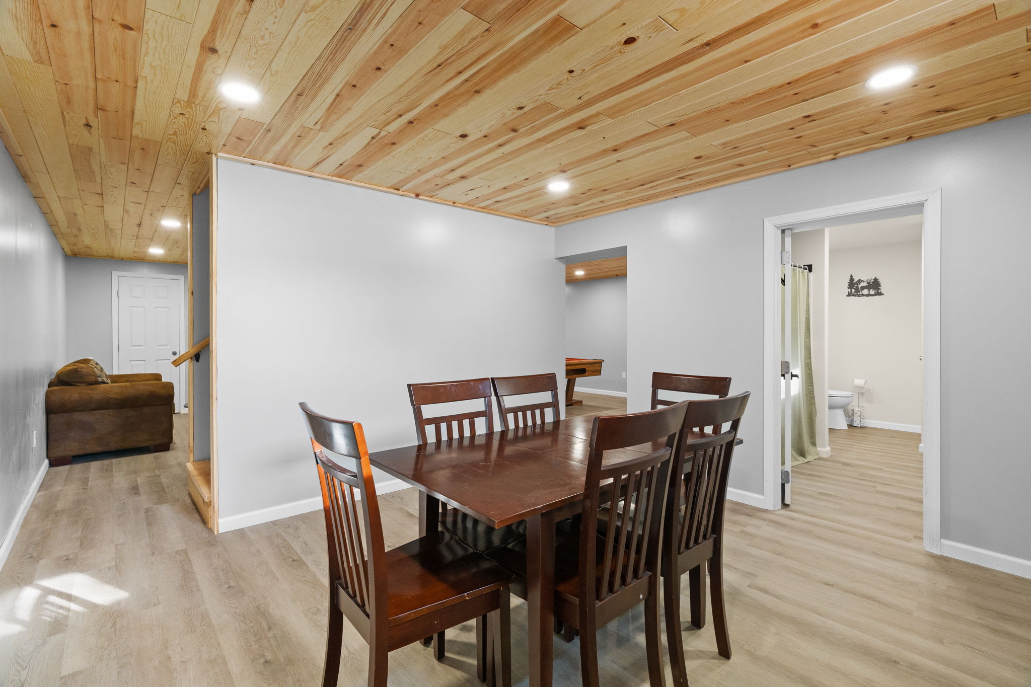 Stairs connect the lower level to the main floor with the game room just steps away