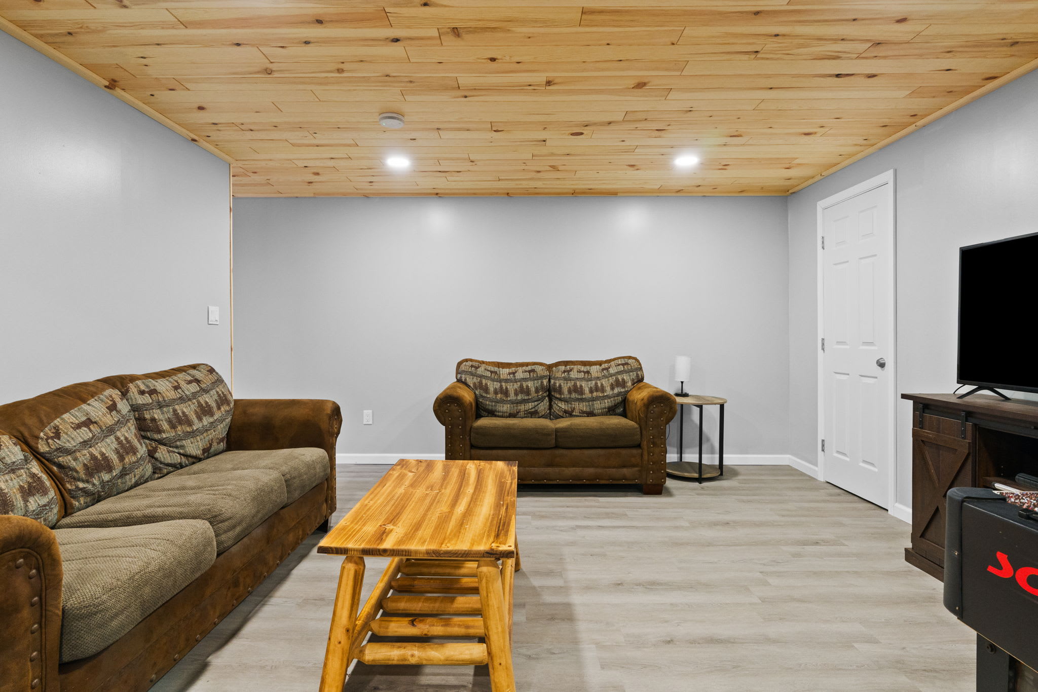 Lounge on the sofas in the game room for movie nights or a post-ski wind down