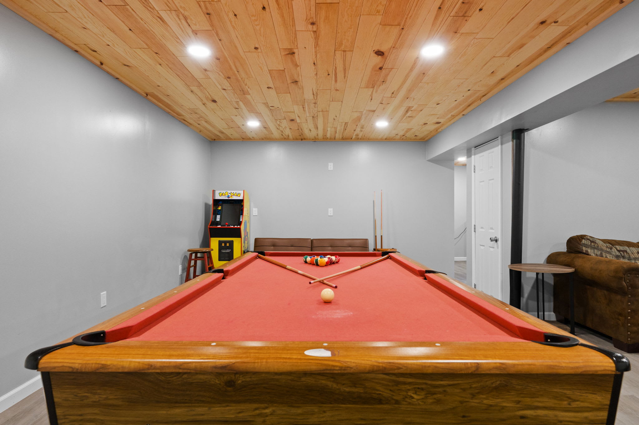 The red-felted pool table is ready for your next tournament night