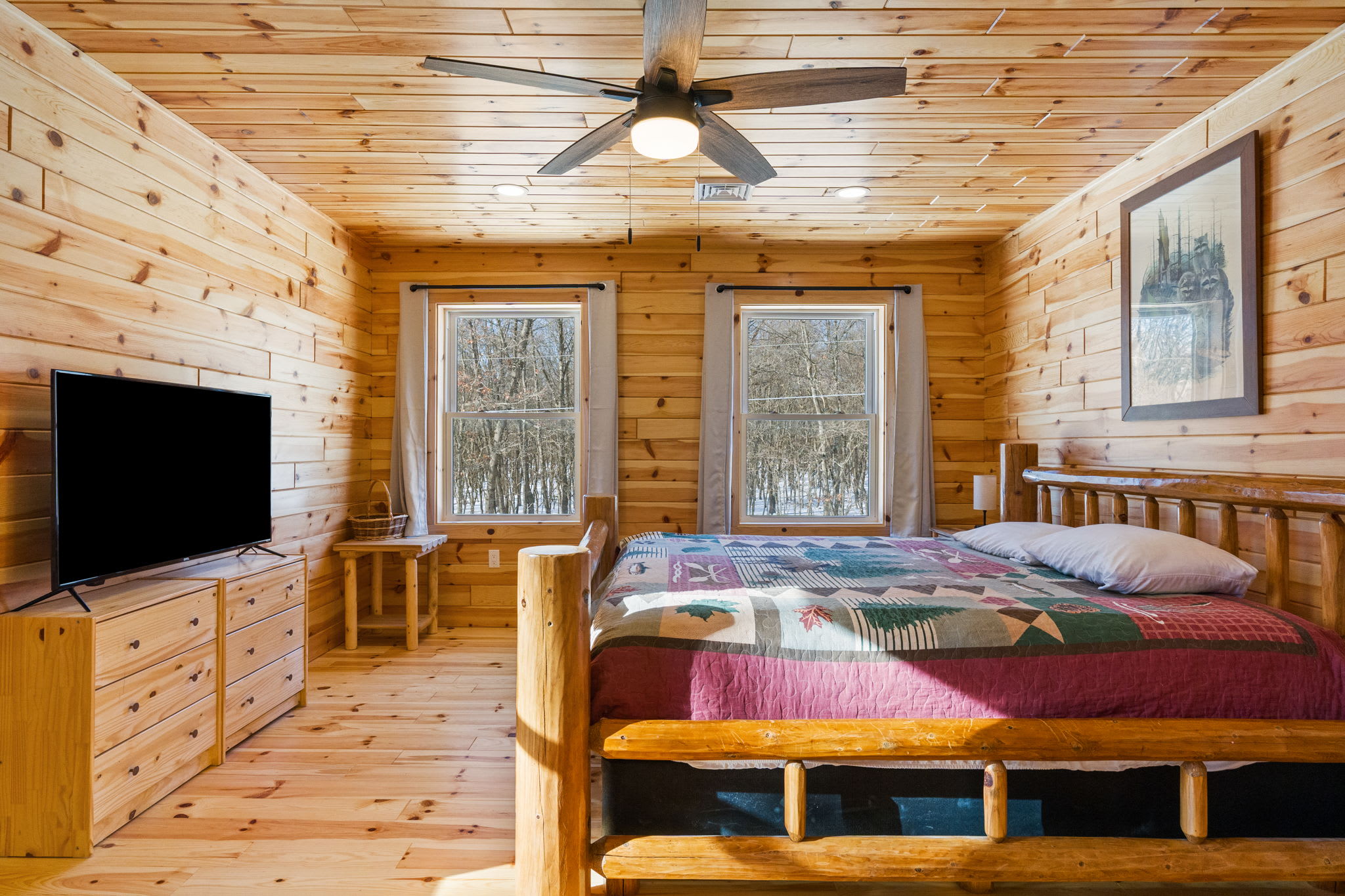A sunny dining nook with log cabin charm and views of the surrounding trees