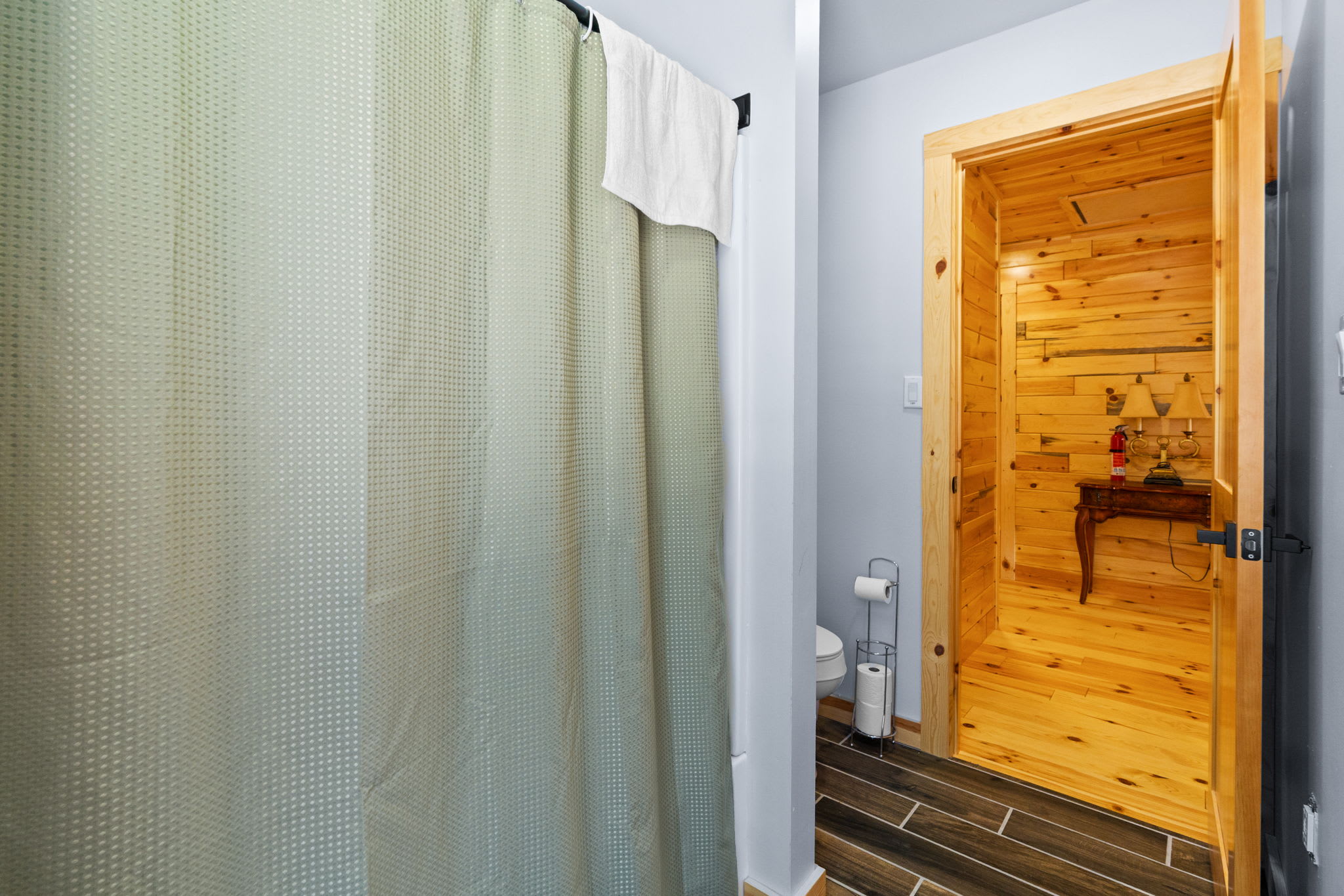 A tidy hallway with closet access connects the lower-level bedrooms and bath